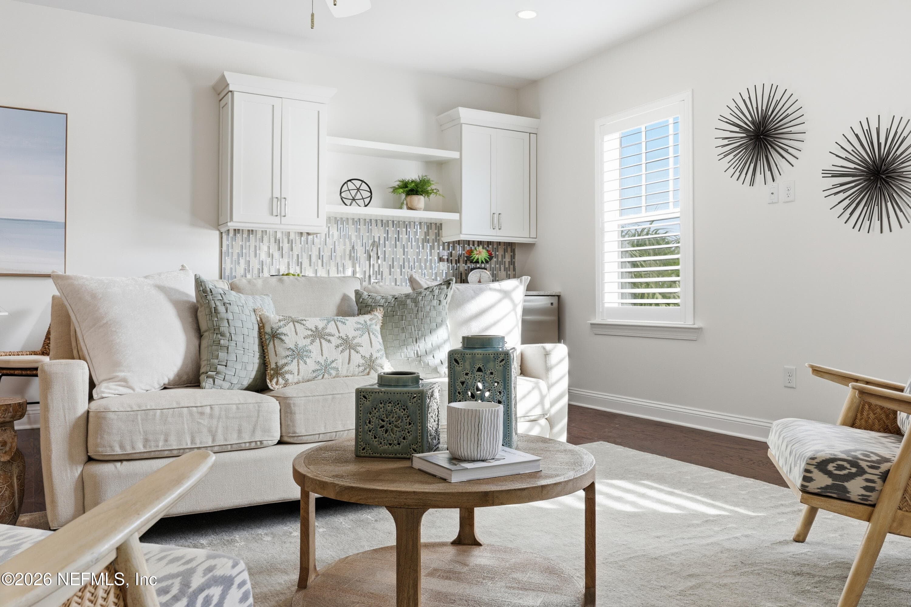 2nd floor living area with bright windows and coastal-inspired staging. — 568 TIMBER BRIDGE Lane, Atlantic Beach, FL 32233