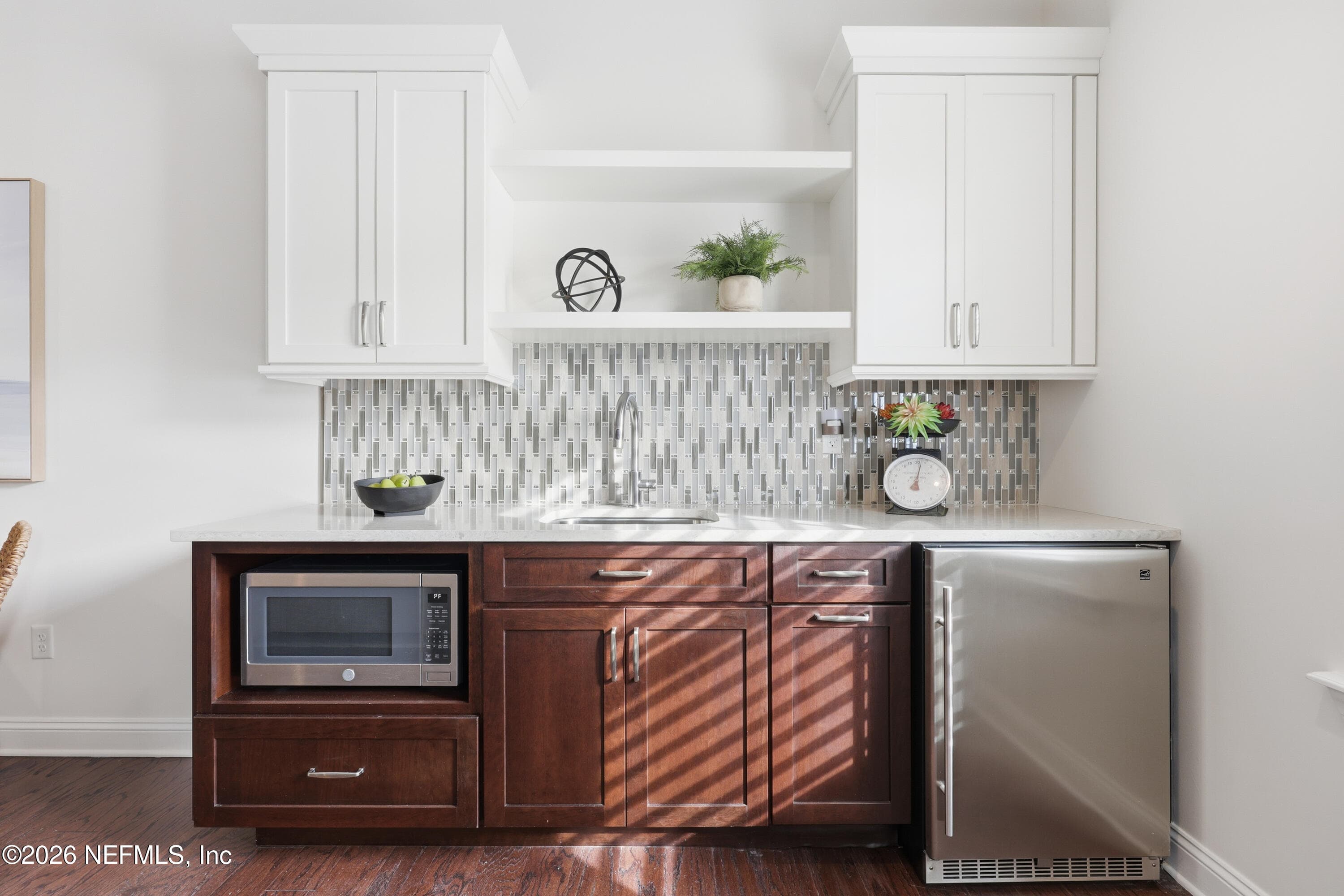 Wet bar/mini-kitchen with cabinetry, beverage fridge, and built-in microwave. — 568 TIMBER BRIDGE Lane, Atlantic Beach, FL 32233