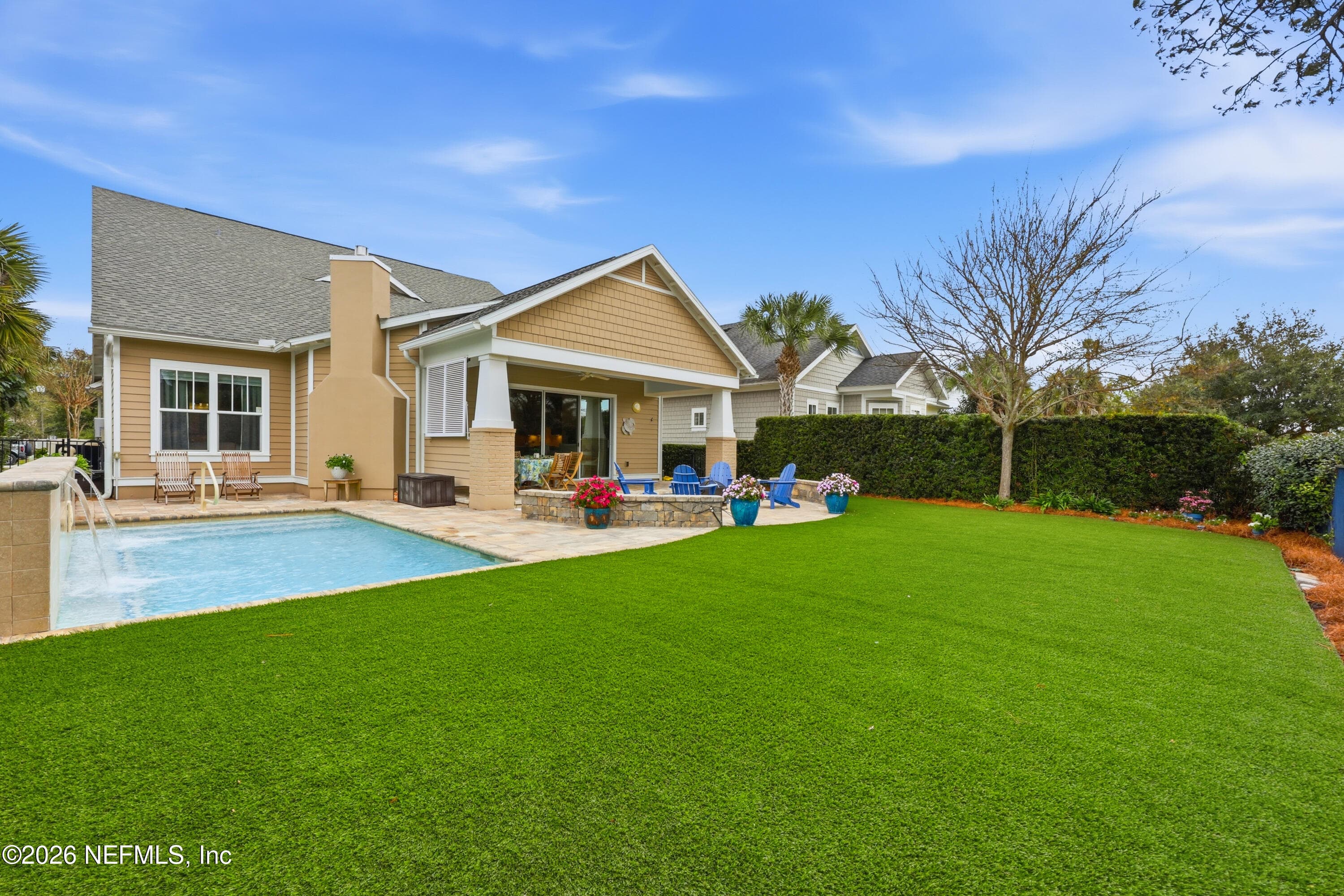 Backyard with pool positioned to the side, preserving a wide lawn/turf area. — 568 TIMBER BRIDGE Lane, Atlantic Beach, FL 32233
