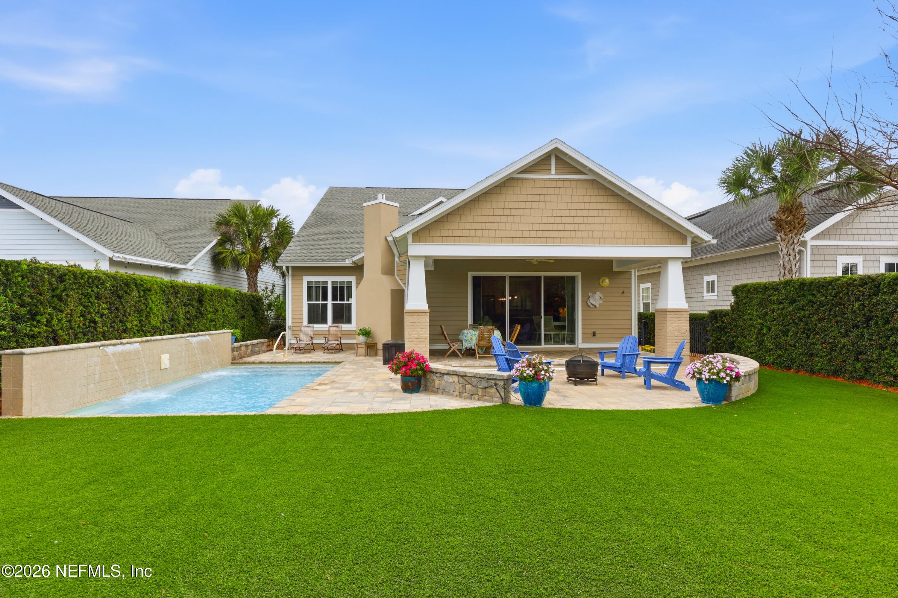 Backyard showing lawn/turf area, pool, and patio seating zones. — 568 TIMBER BRIDGE Lane, Atlantic Beach, FL 32233