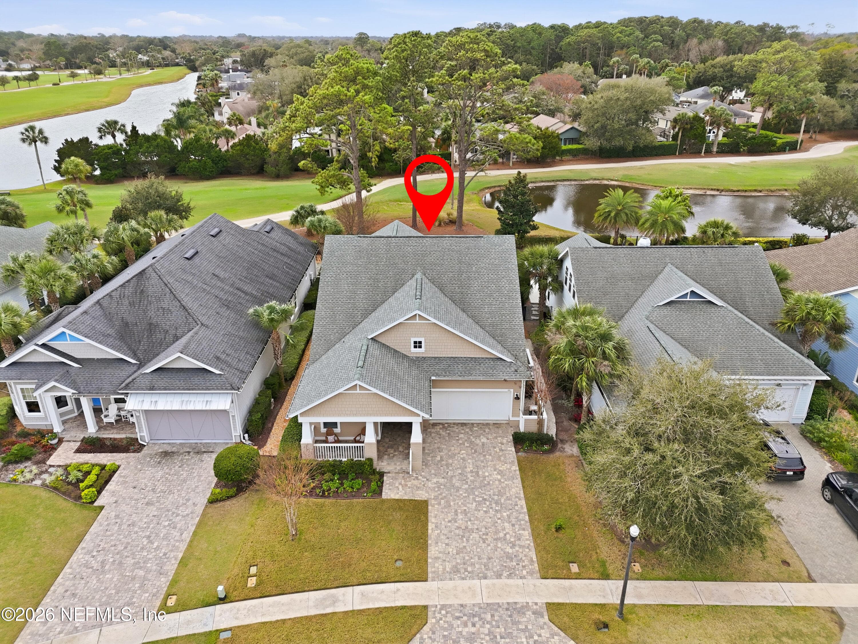 Aerial with home marked, showing proximity to water feature and golf-course greens. — 568 TIMBER BRIDGE Lane, Atlantic Beach, FL 32233