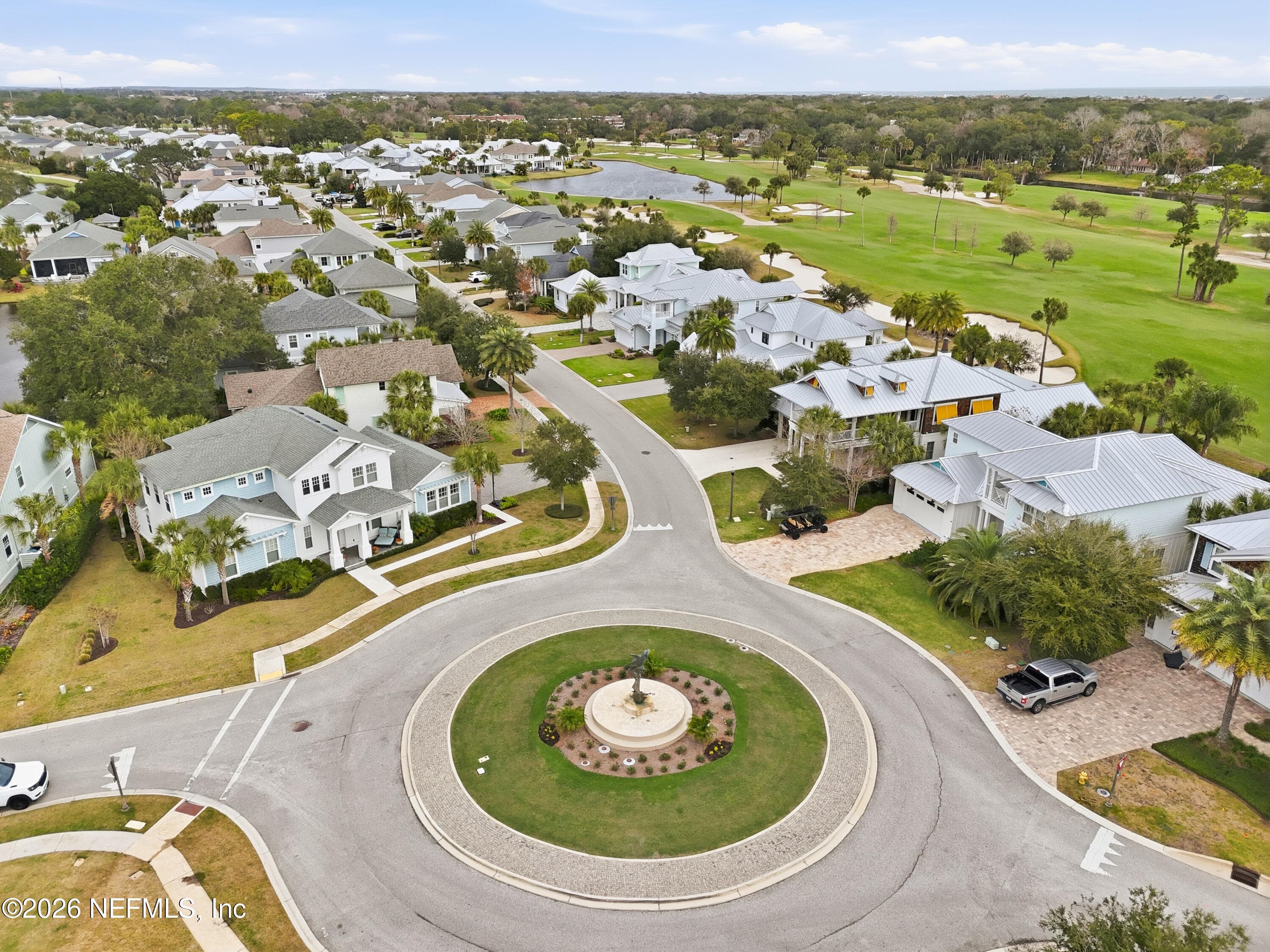 Aerial view of community roundabout and surrounding homes near golf. — 568 TIMBER BRIDGE Lane, Atlantic Beach, FL 32233