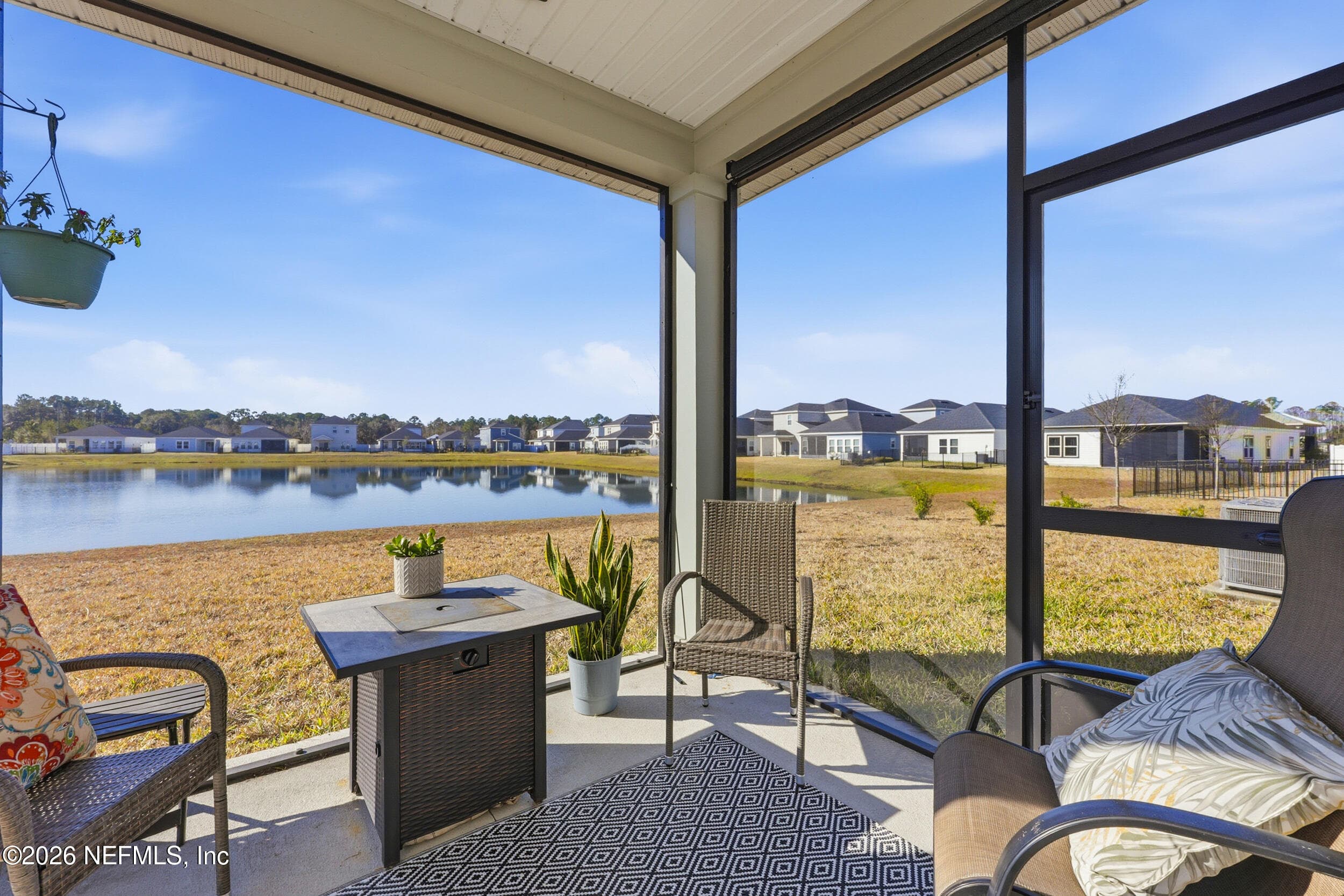 Owner screened covered patio and added retractable sun shade — 95252 TERRIS Way, Fernandina Beach, FL 32034