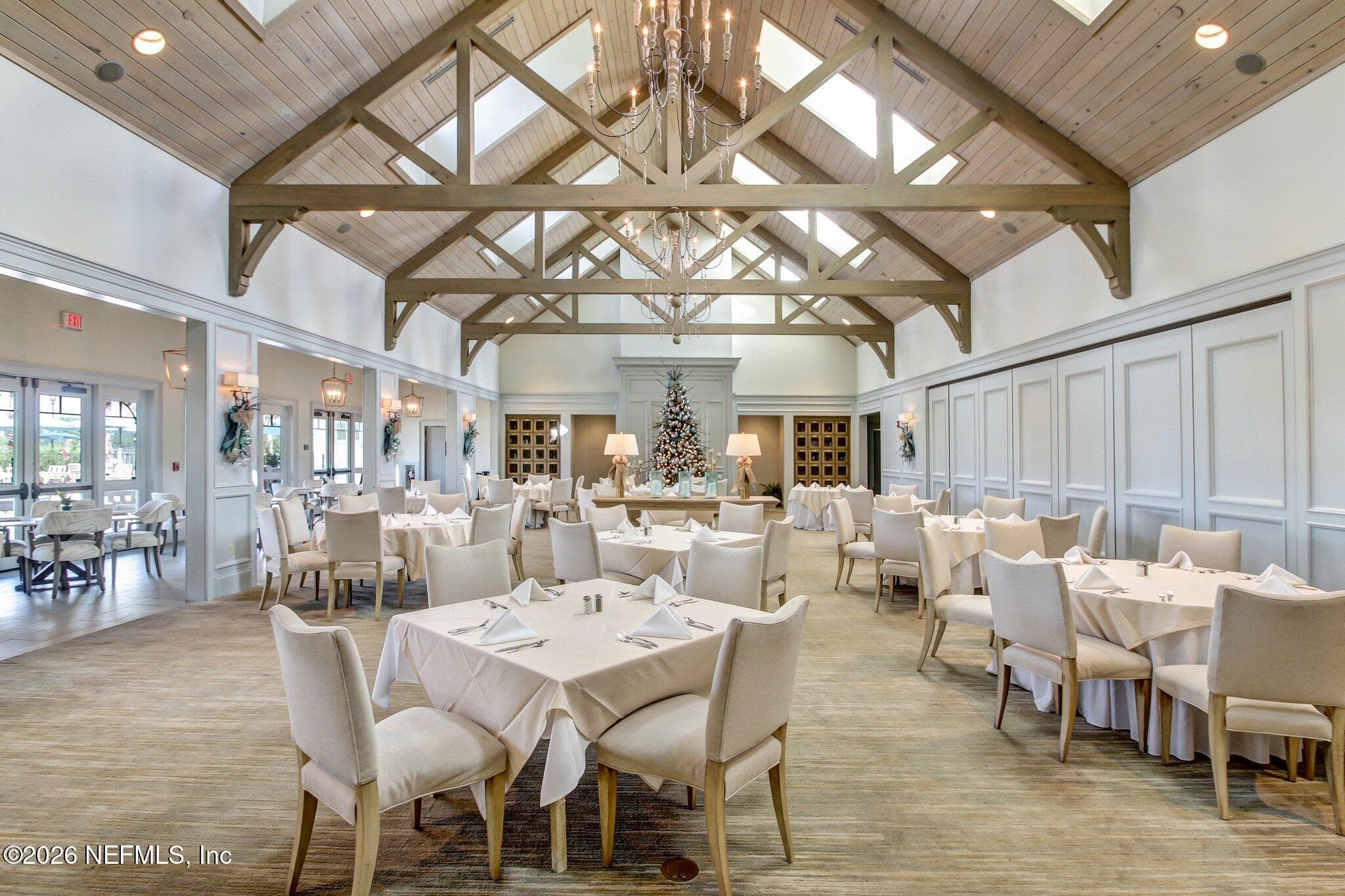 Club dining space showing high ceilings and open seating layout. — 568 TIMBER BRIDGE Lane, Atlantic Beach, FL 32233