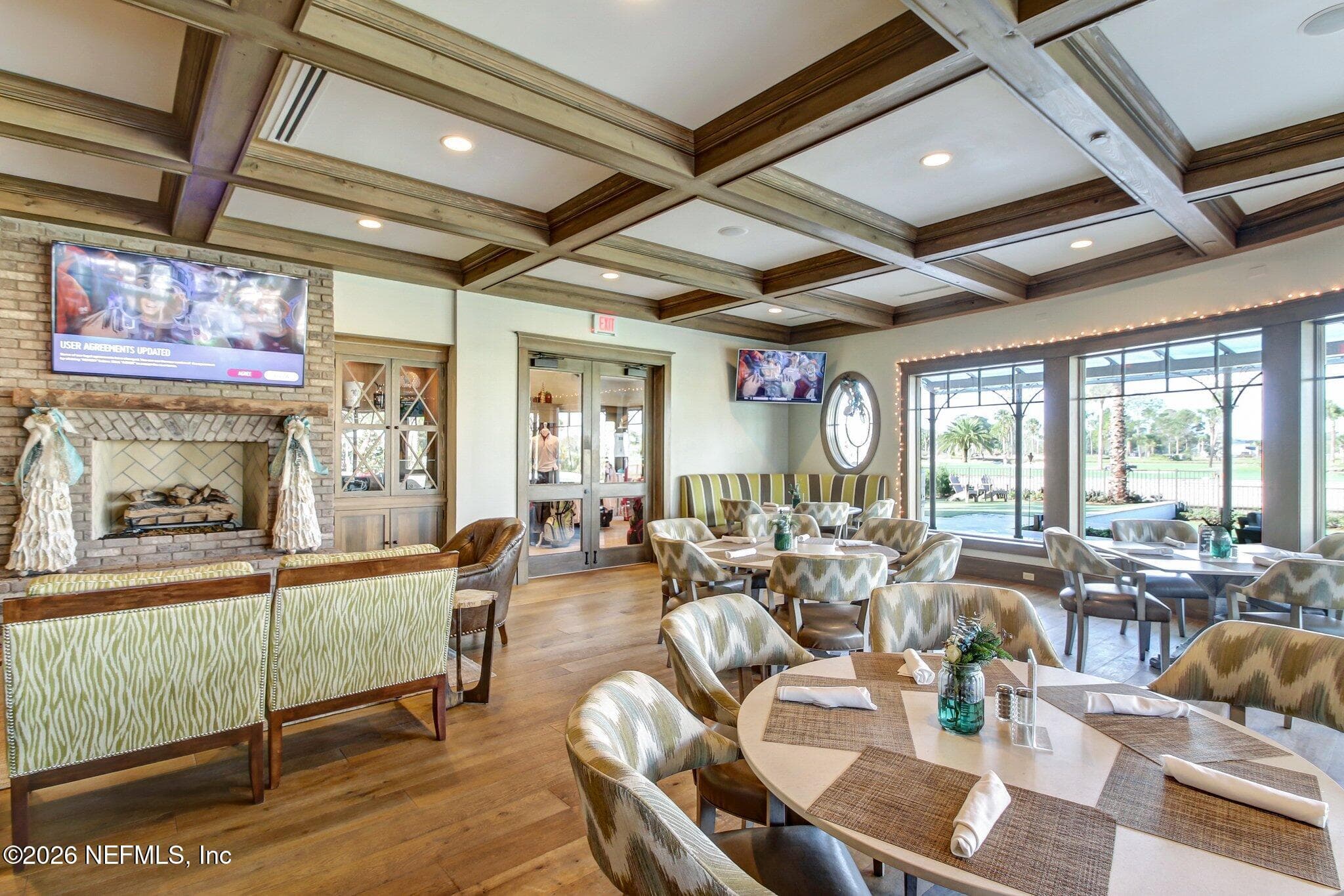 Club lounge with beamed ceiling and seating areas for relaxing between activities. — 568 TIMBER BRIDGE Lane, Atlantic Beach, FL 32233