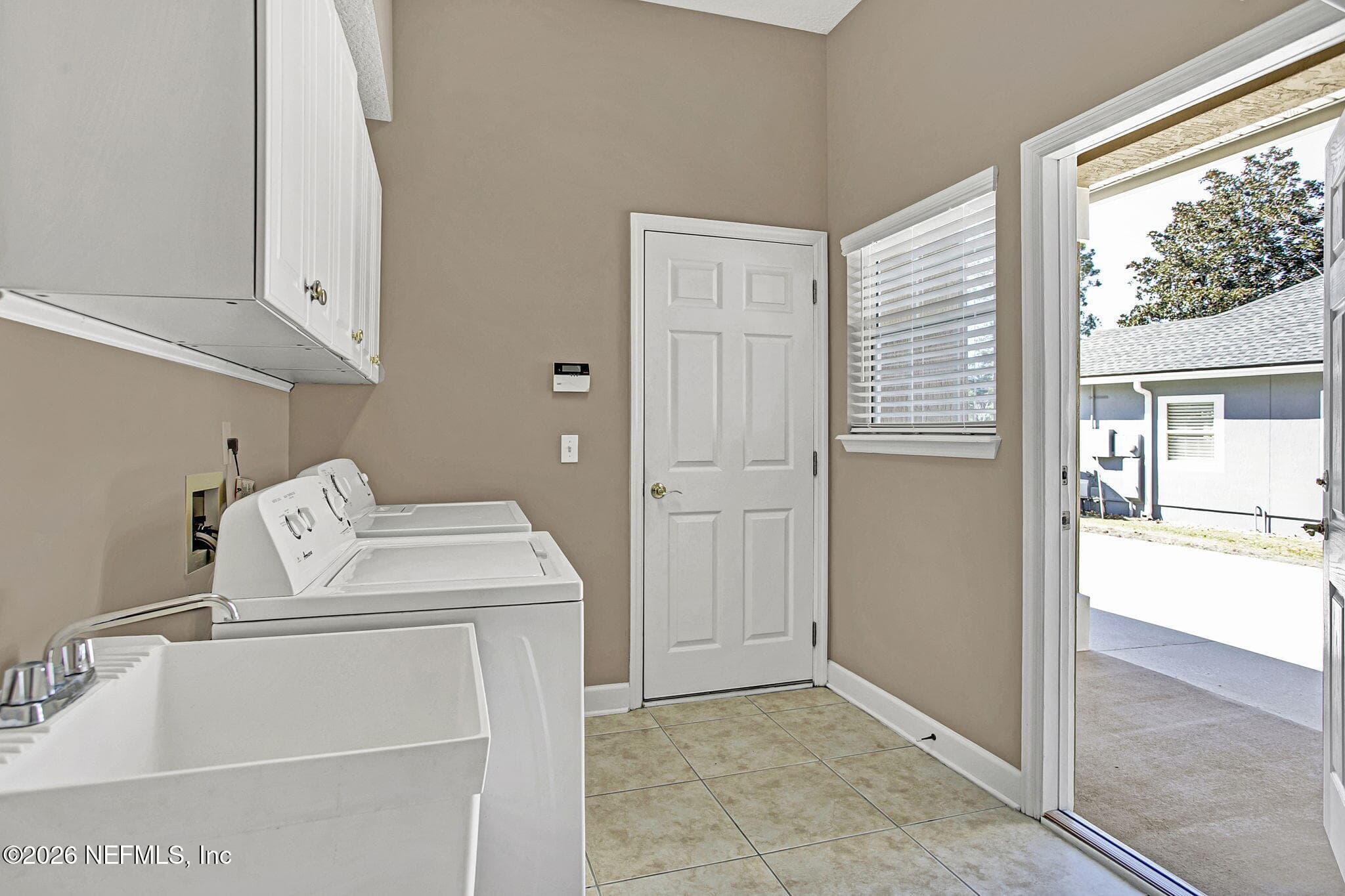 Side Home Entry Into The Laundry Room With Garage Entry — 3576 BARTON CREEK Circle, Green Cove Springs, FL 32043