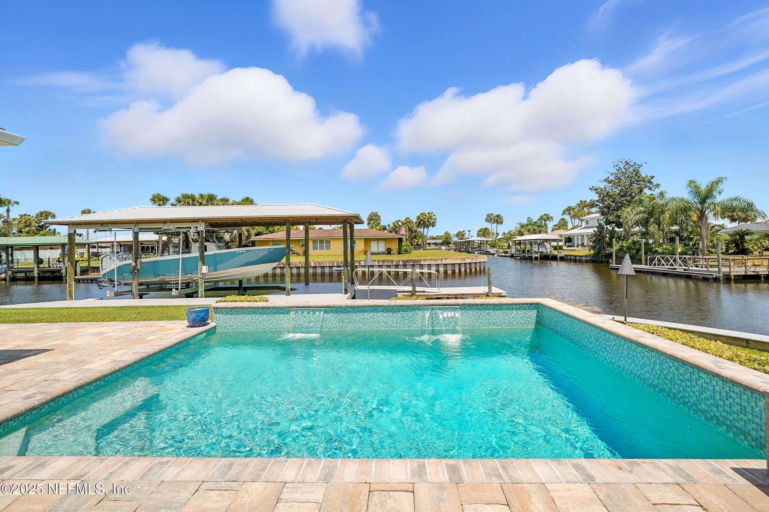 saltwater pool with privacy wall and waterfalls — 3367 ROYAL PALM Drive, Jacksonville, FL 32250