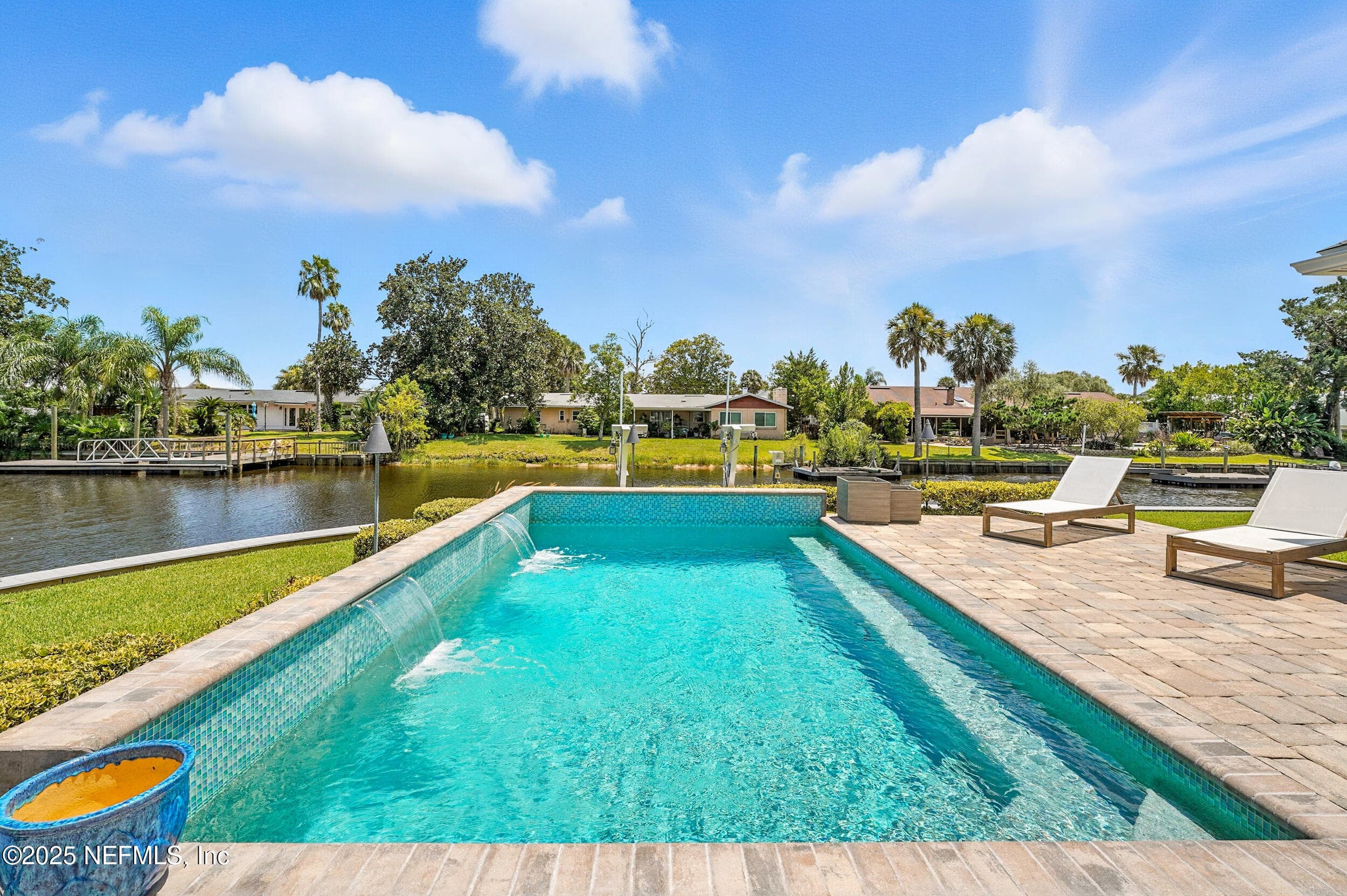 saltwater heated pool with waterfalls and privacy wall — 3367 ROYAL PALM Drive, Jacksonville, FL 32250