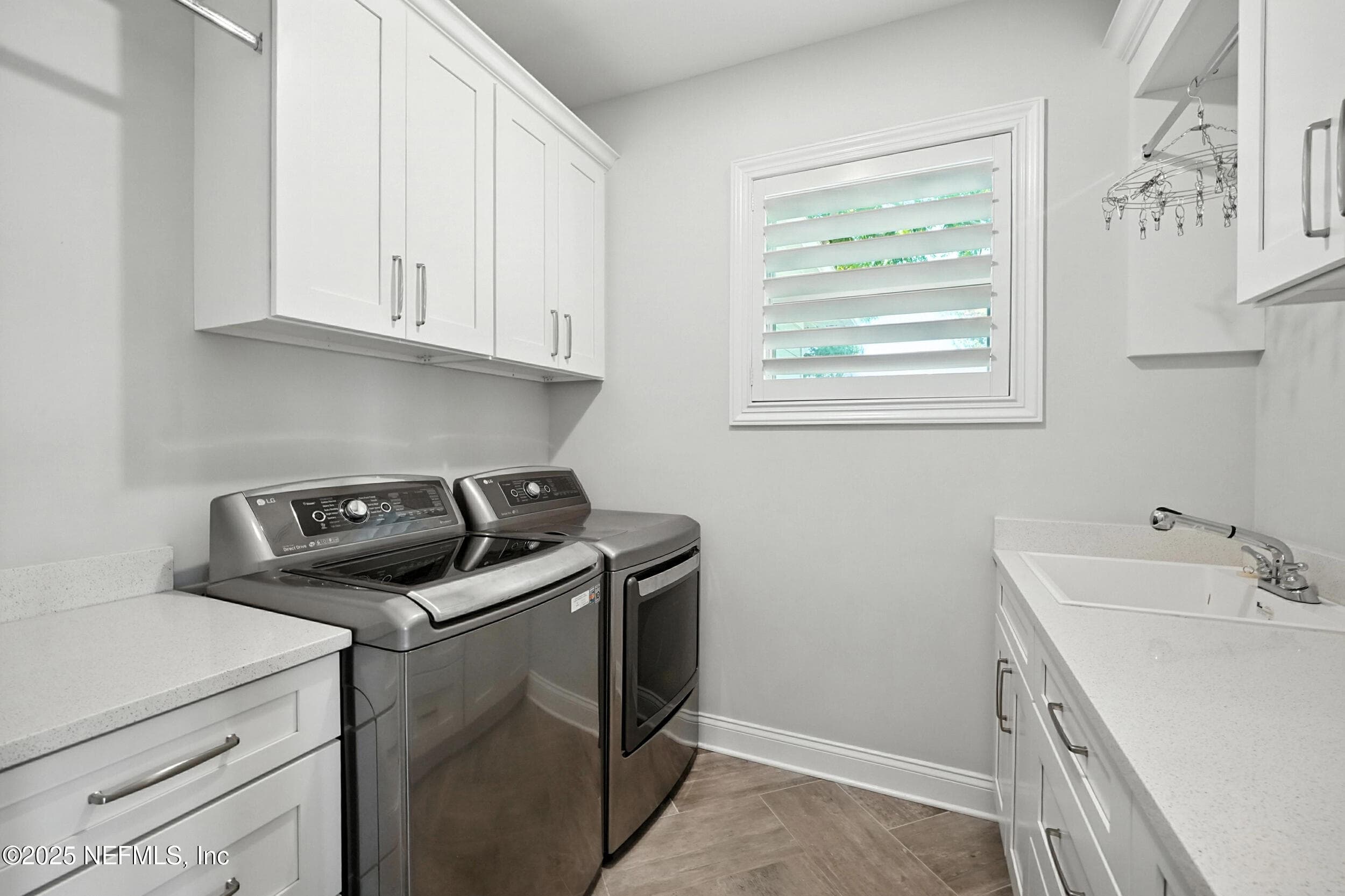laundry with sink and cabinets — 3367 ROYAL PALM Drive, Jacksonville, FL 32250