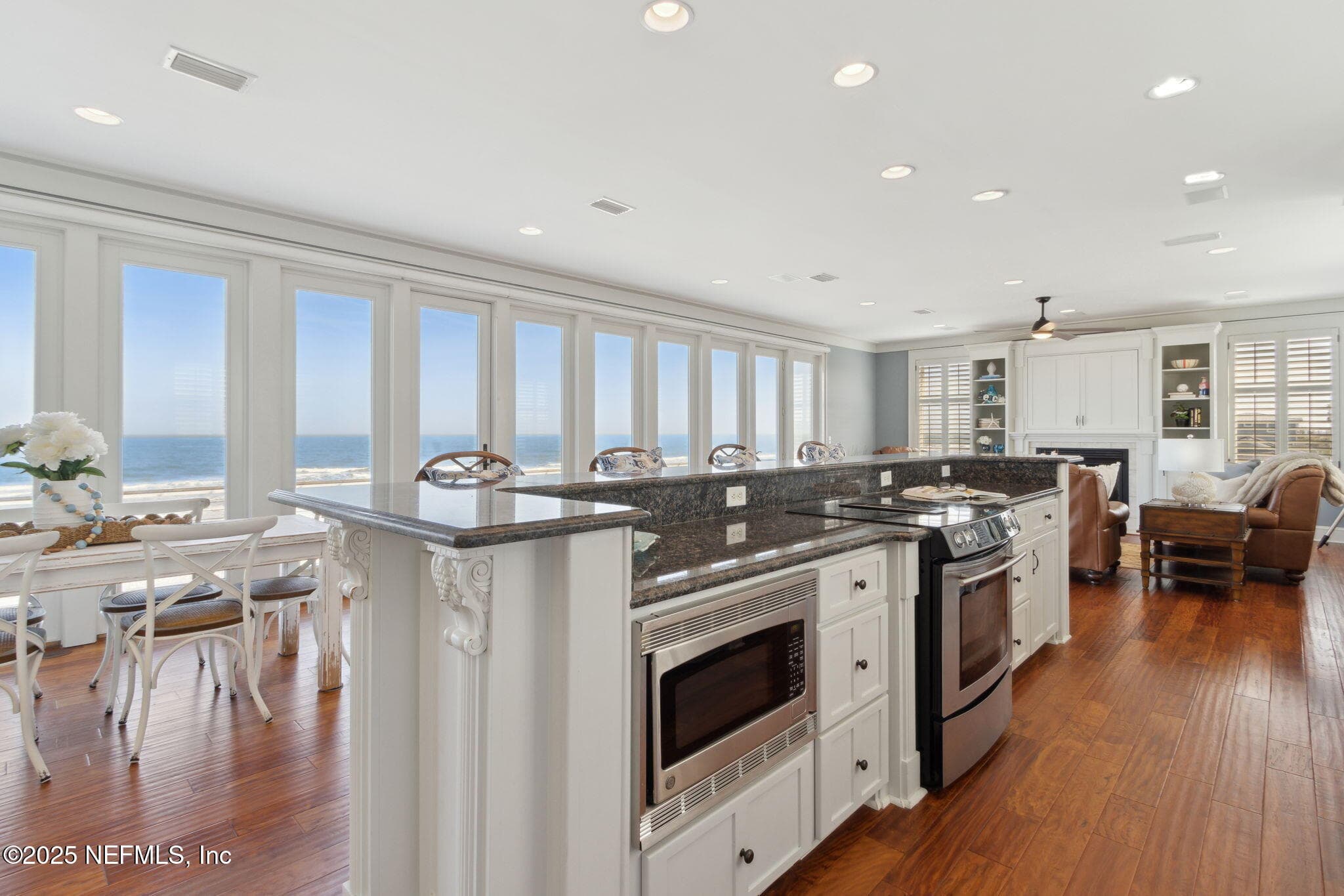In the kitchen, ocean views transform cooking into a delight. — 822 S FLETCHER Avenue, Fernandina Beach, FL 32034