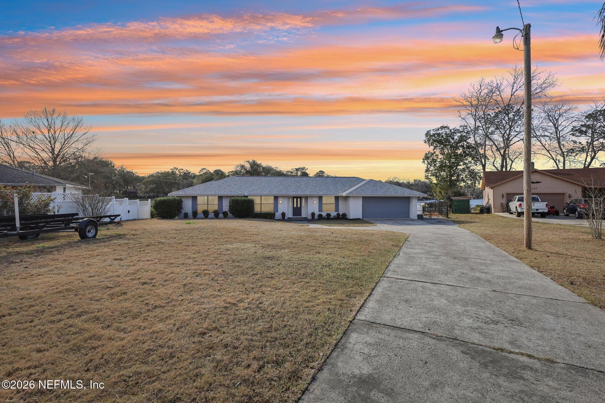 Twilight view showcasing the peaceful setting and curb appeal — 244 JESSIE LEE Court, Green Cove Springs, FL 32043