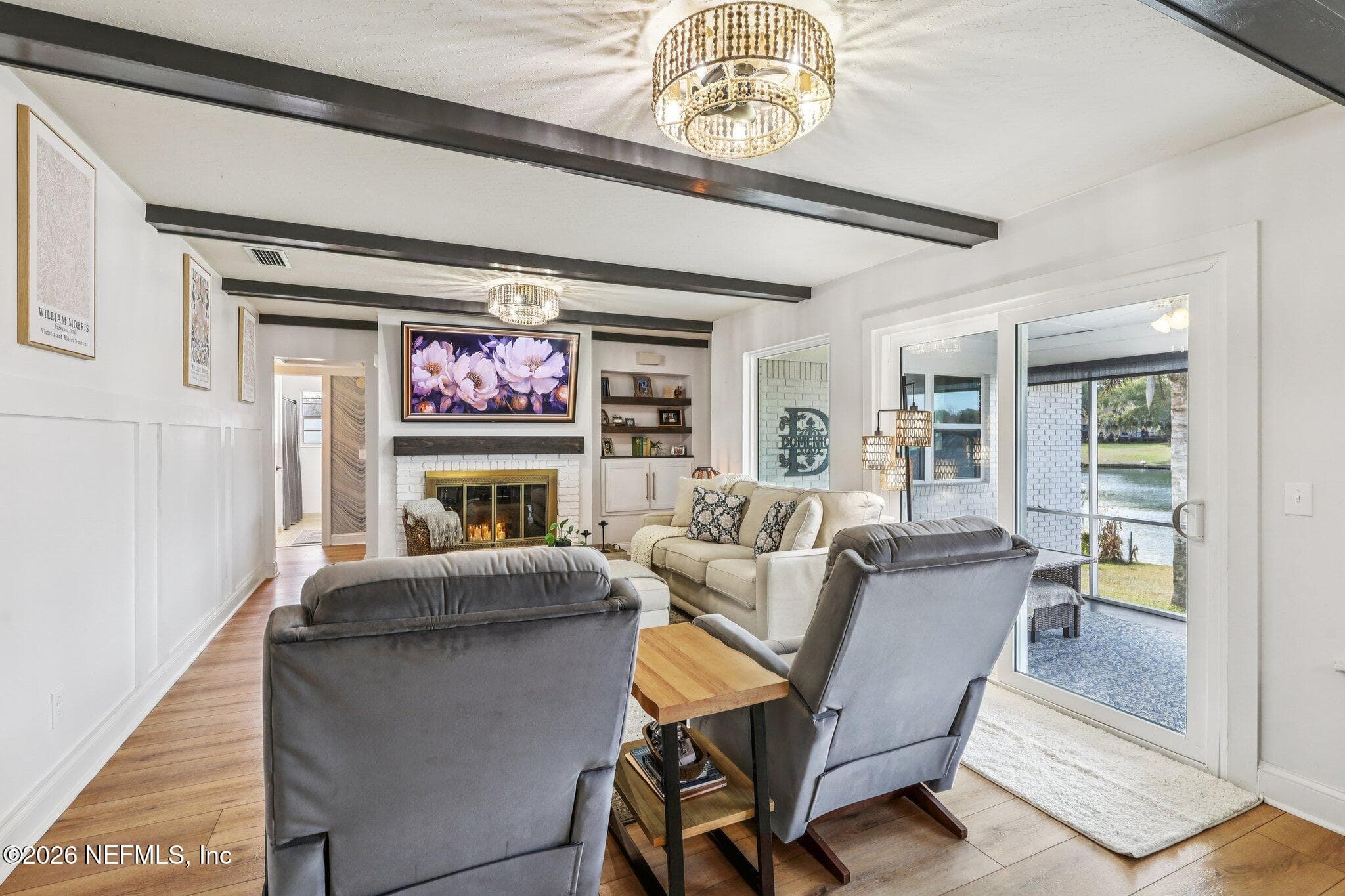 Living room with built ins and sliders overlooking the lake — 244 JESSIE LEE Court, Green Cove Springs, FL 32043