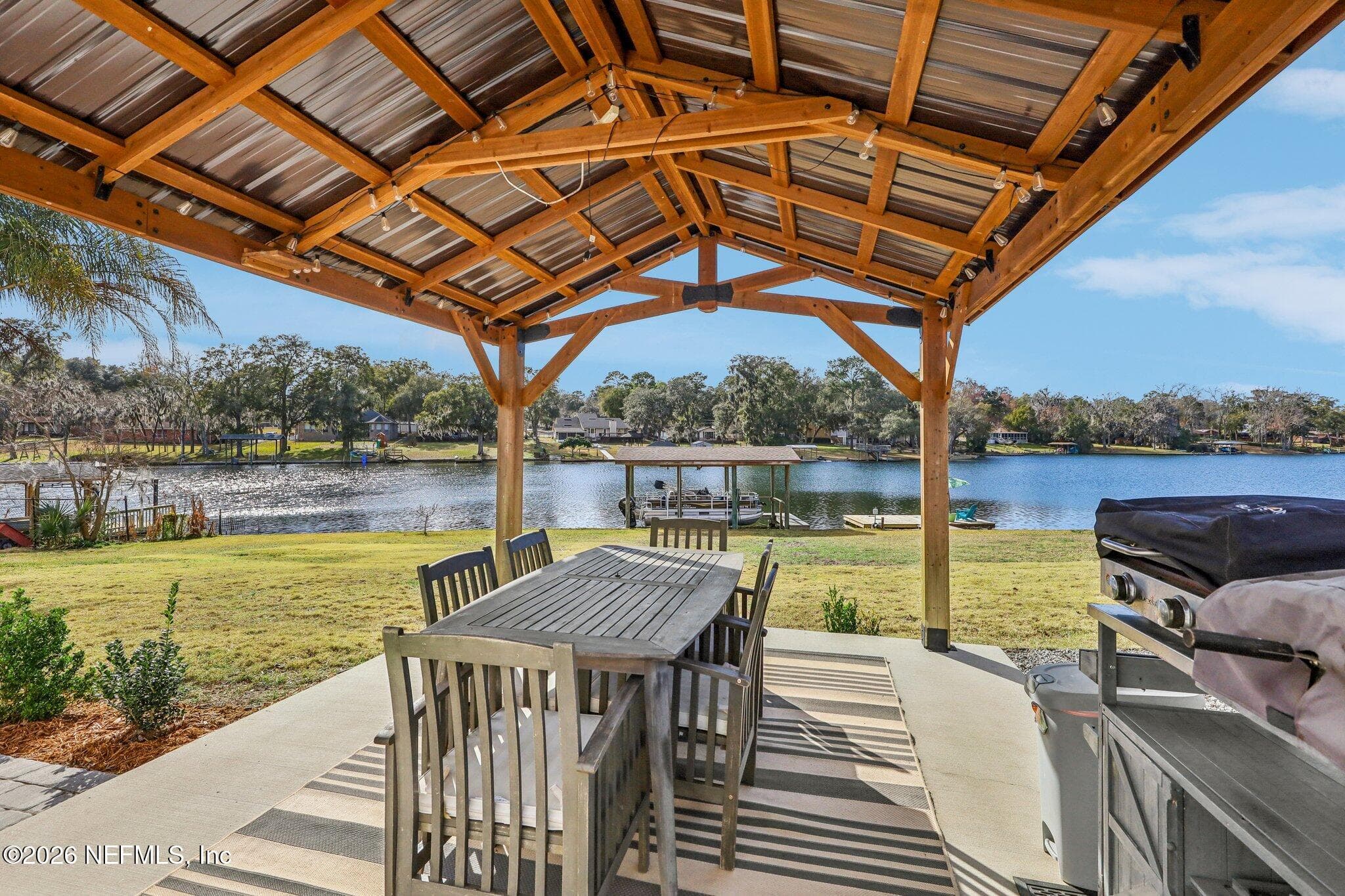 Covered pergola dining area perfect for outdoor gatherings — 244 JESSIE LEE Court, Green Cove Springs, FL 32043