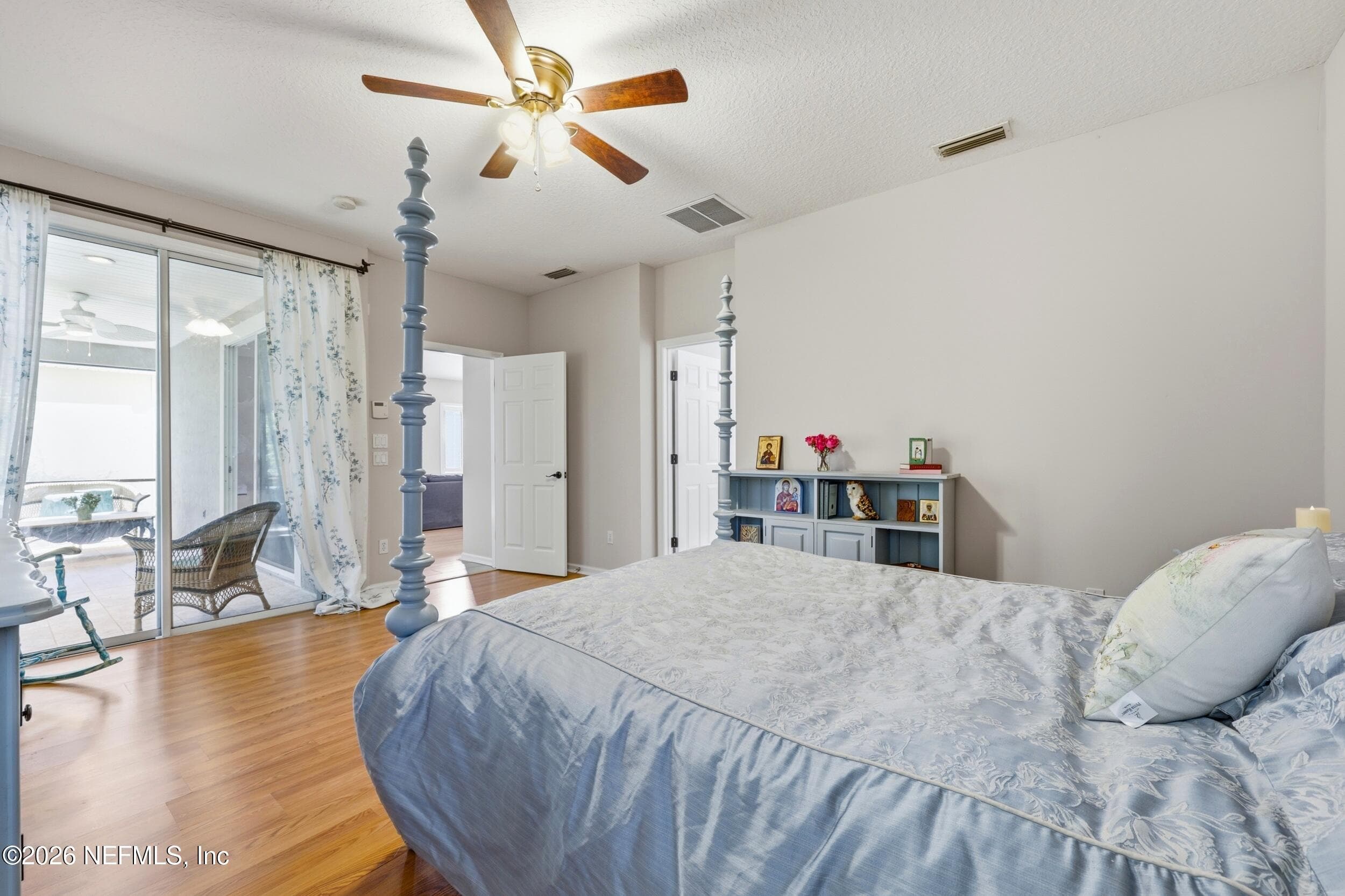 Sliding Doors let in natural light from backyard porch — 96177 LONG BEACH Drive, Fernandina Beach, FL 32034