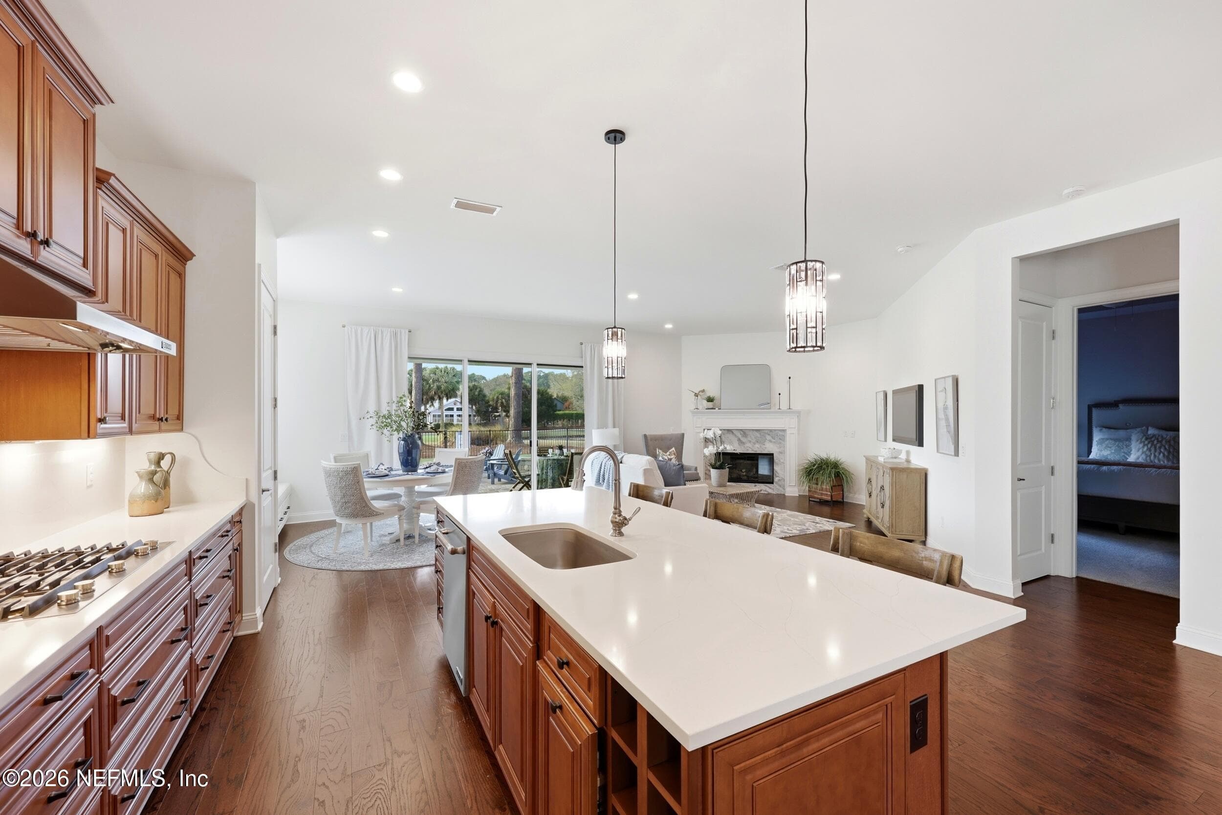 Designed for connection and effortless entertaining, this spacious kitchen offers generous seating and the perfect setting for everything from casual mornings to lively evenings with friends and family. — 568 TIMBER BRIDGE Lane, Atlantic Beach, FL 32233