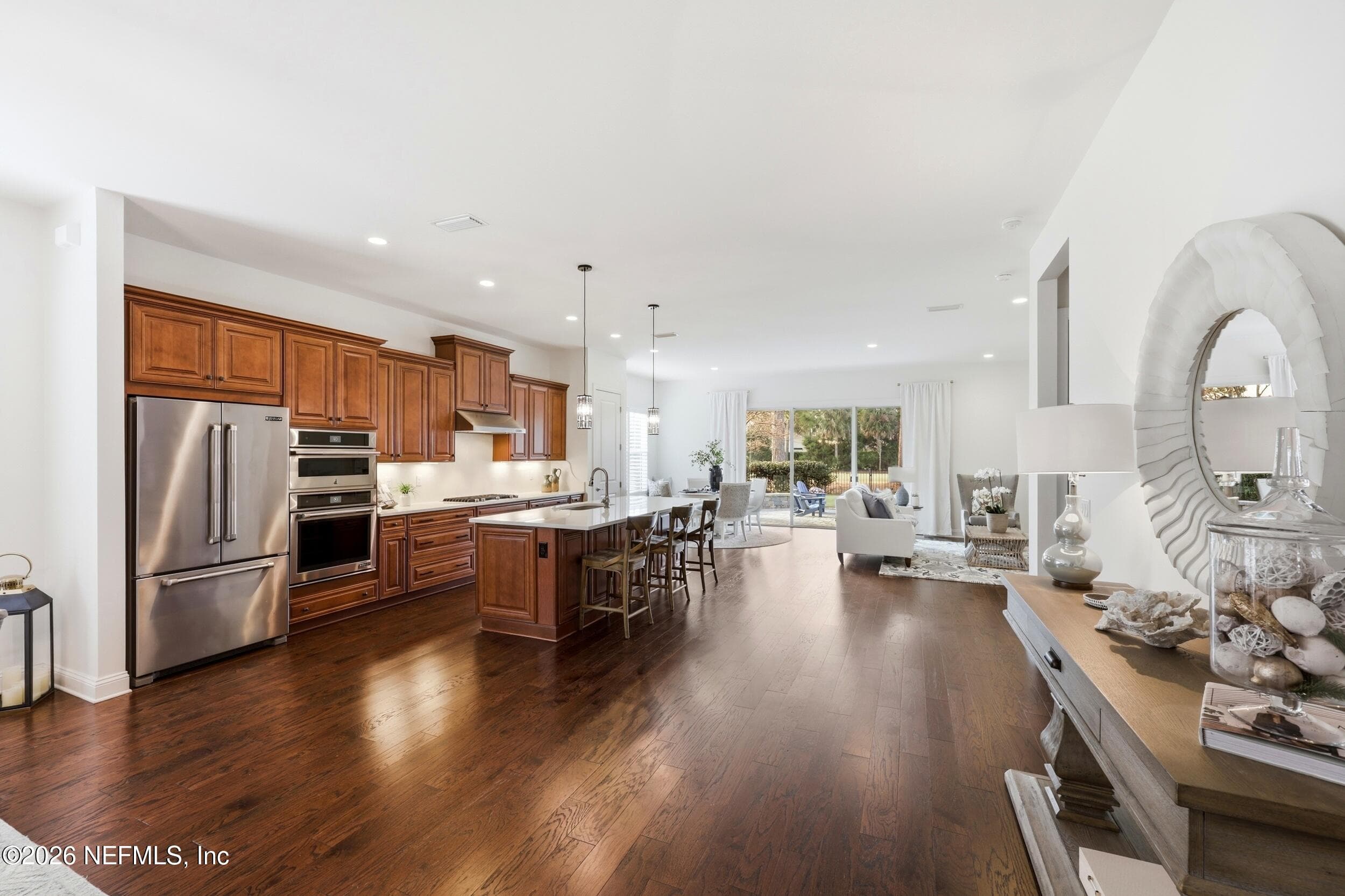 Entertain family and friends in the expansive first-floor that blends dining, kitchen, and living spaces into one seamless showcase. — 568 TIMBER BRIDGE Lane, Atlantic Beach, FL 32233