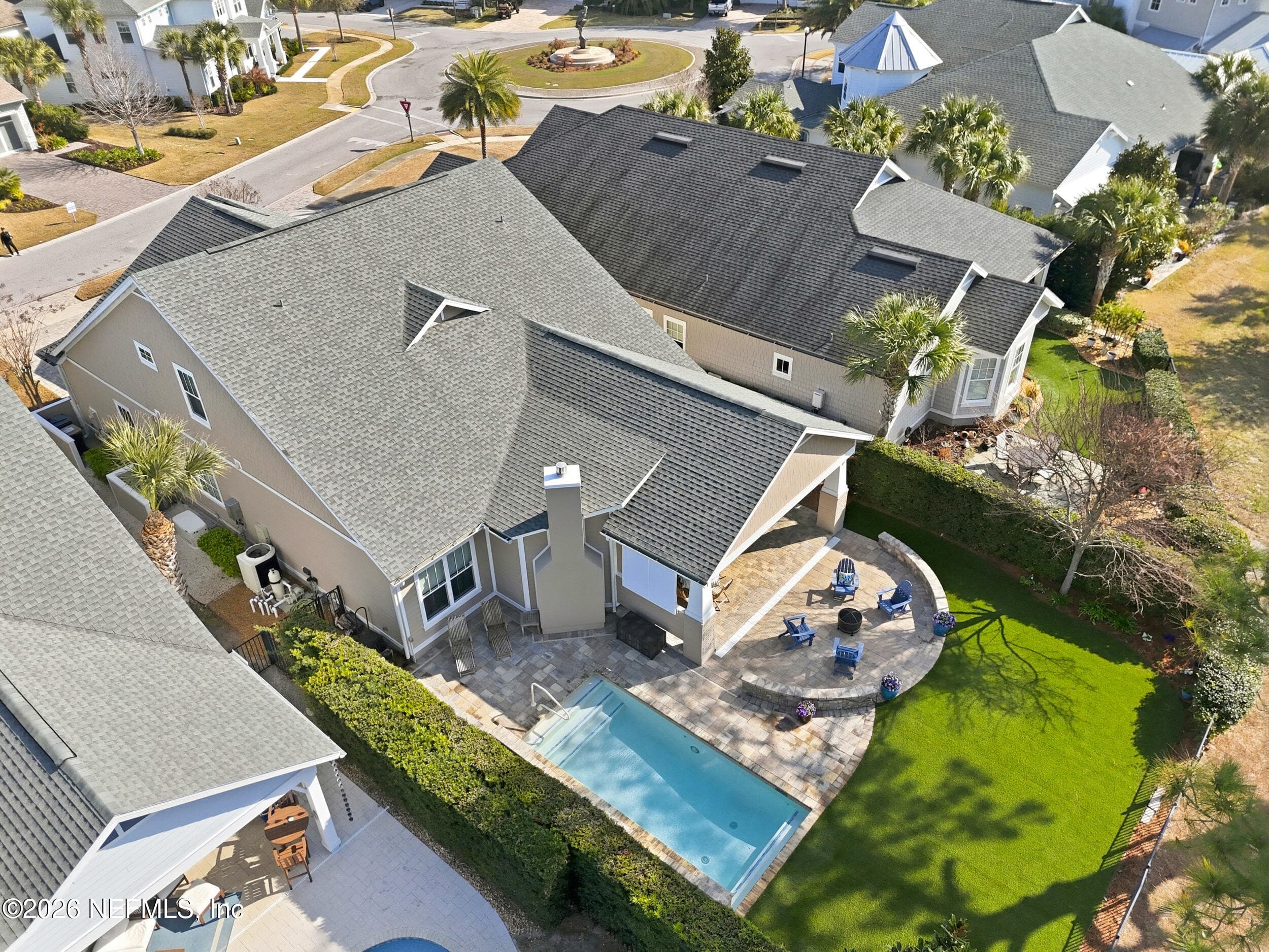 Beautiful view of the expanded patio, large, low-maintenance turf lawn, and luxury pool. — 568 TIMBER BRIDGE Lane, Atlantic Beach, FL 32233