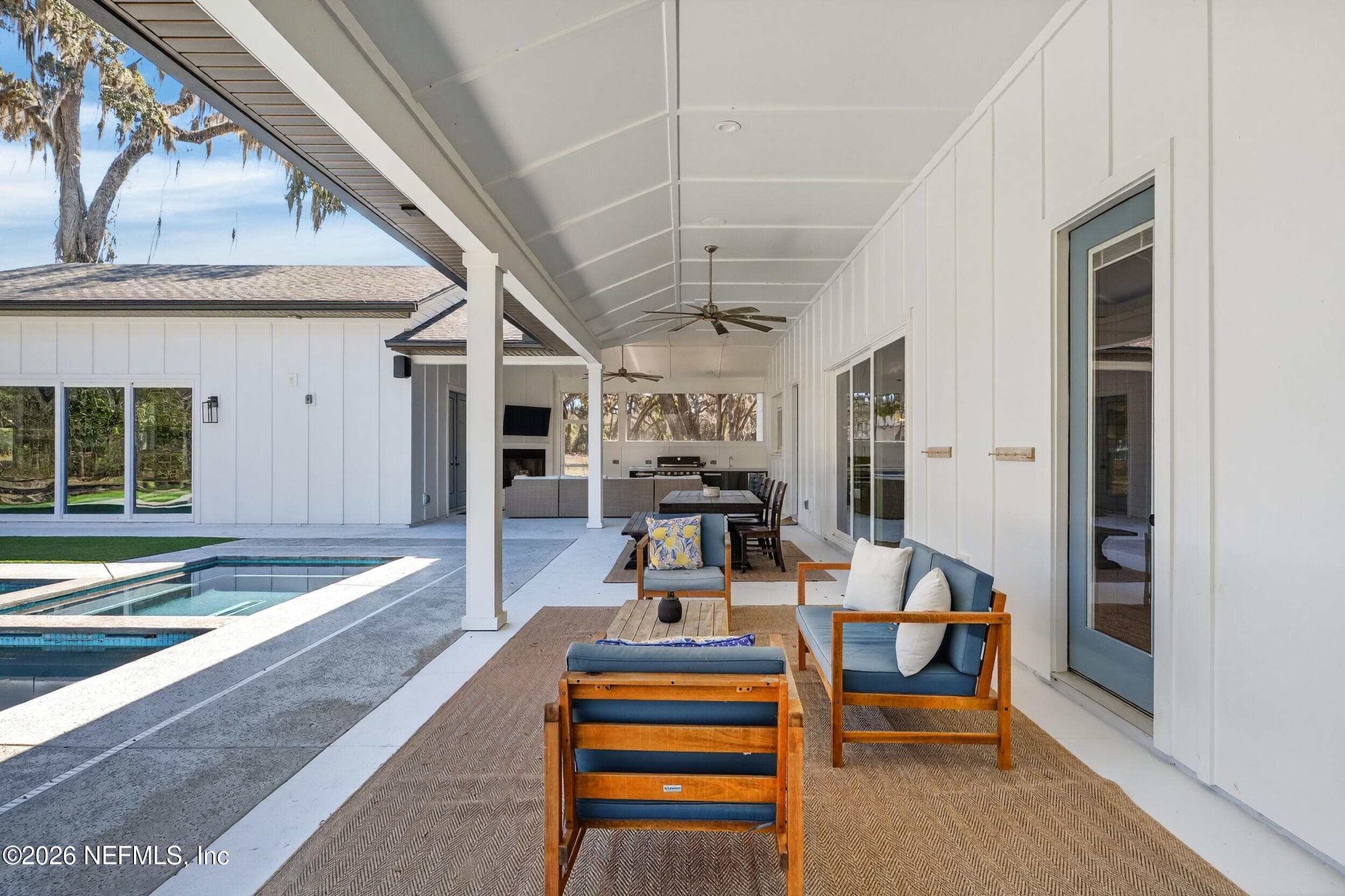 Covered seating by pool — 10800 COUNTY ROAD 13 N, St. Augustine, FL 32092