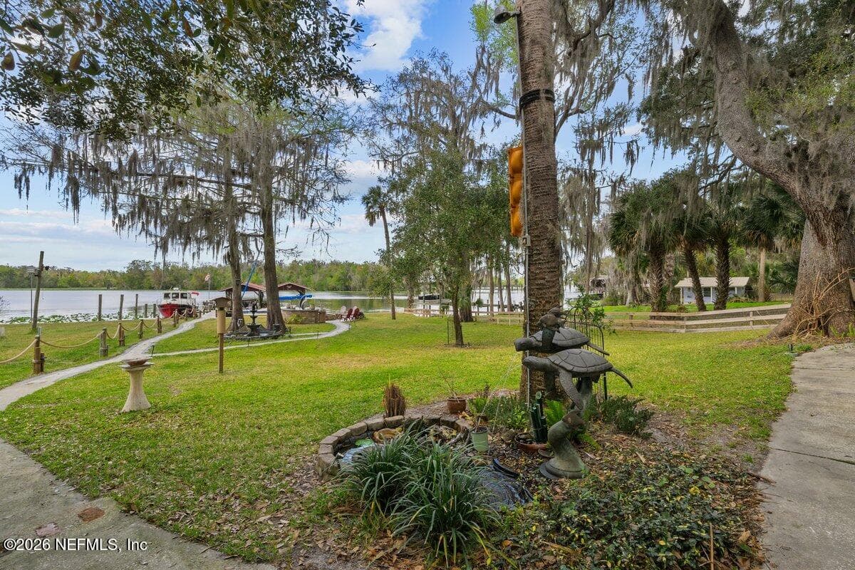Pavers to dock and firepit with wifi connected lighting — 101 ORANGE Street, Satsuma, FL 32189