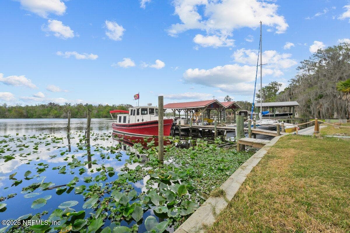 large Dock with 2 covered boat slip with electric lifts and jet ski lift — 101 ORANGE Street, Satsuma, FL 32189
