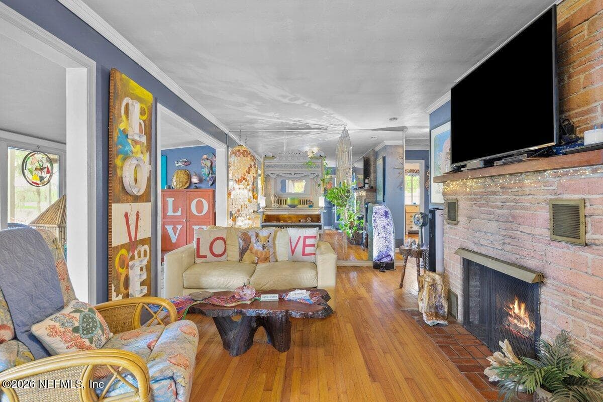 Living room with gas fireplace — 101 ORANGE Street, Satsuma, FL 32189