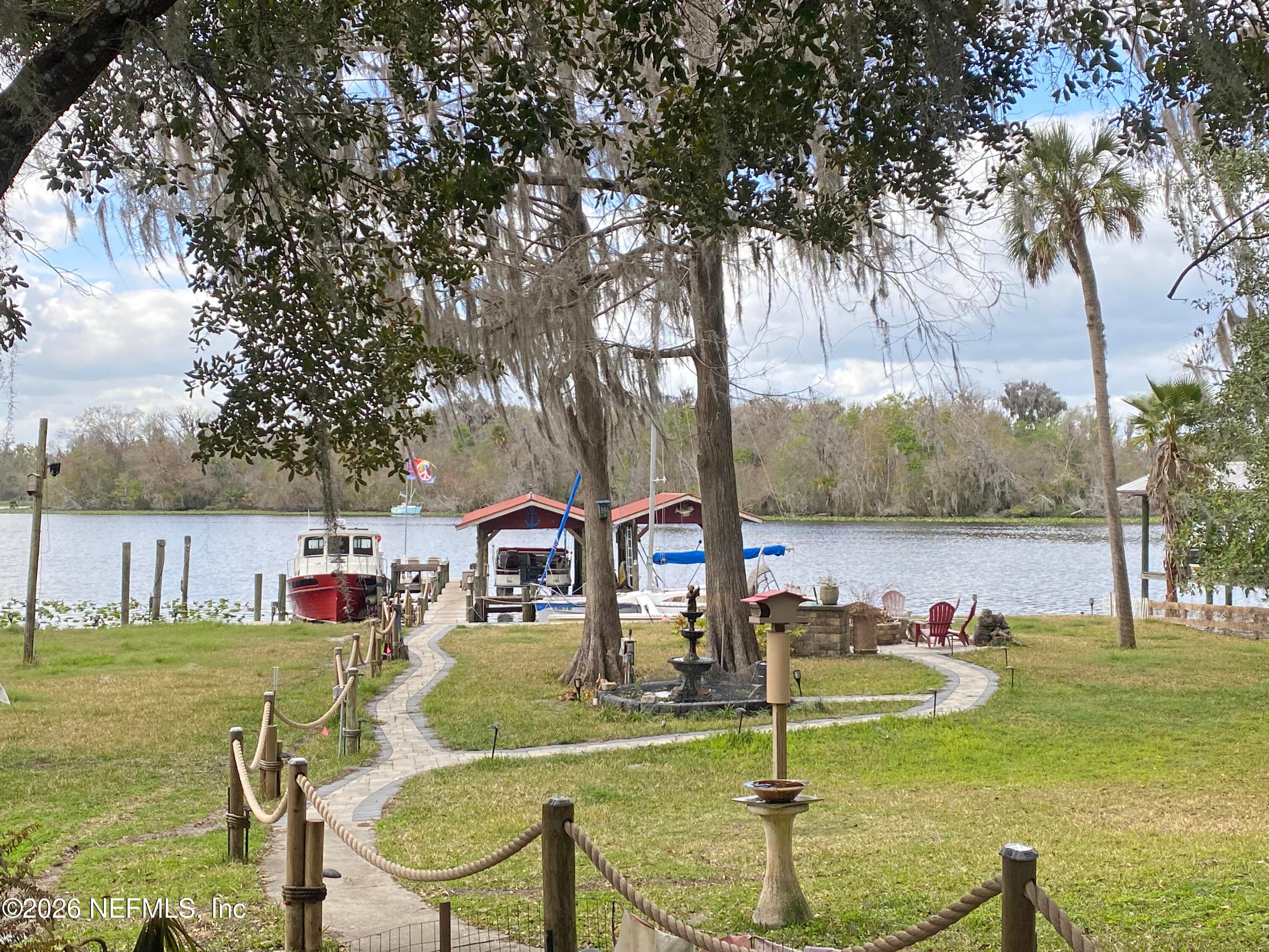Pavers to dock and firepit with wifi connected lighting — 101 ORANGE Street, Satsuma, FL 32189
