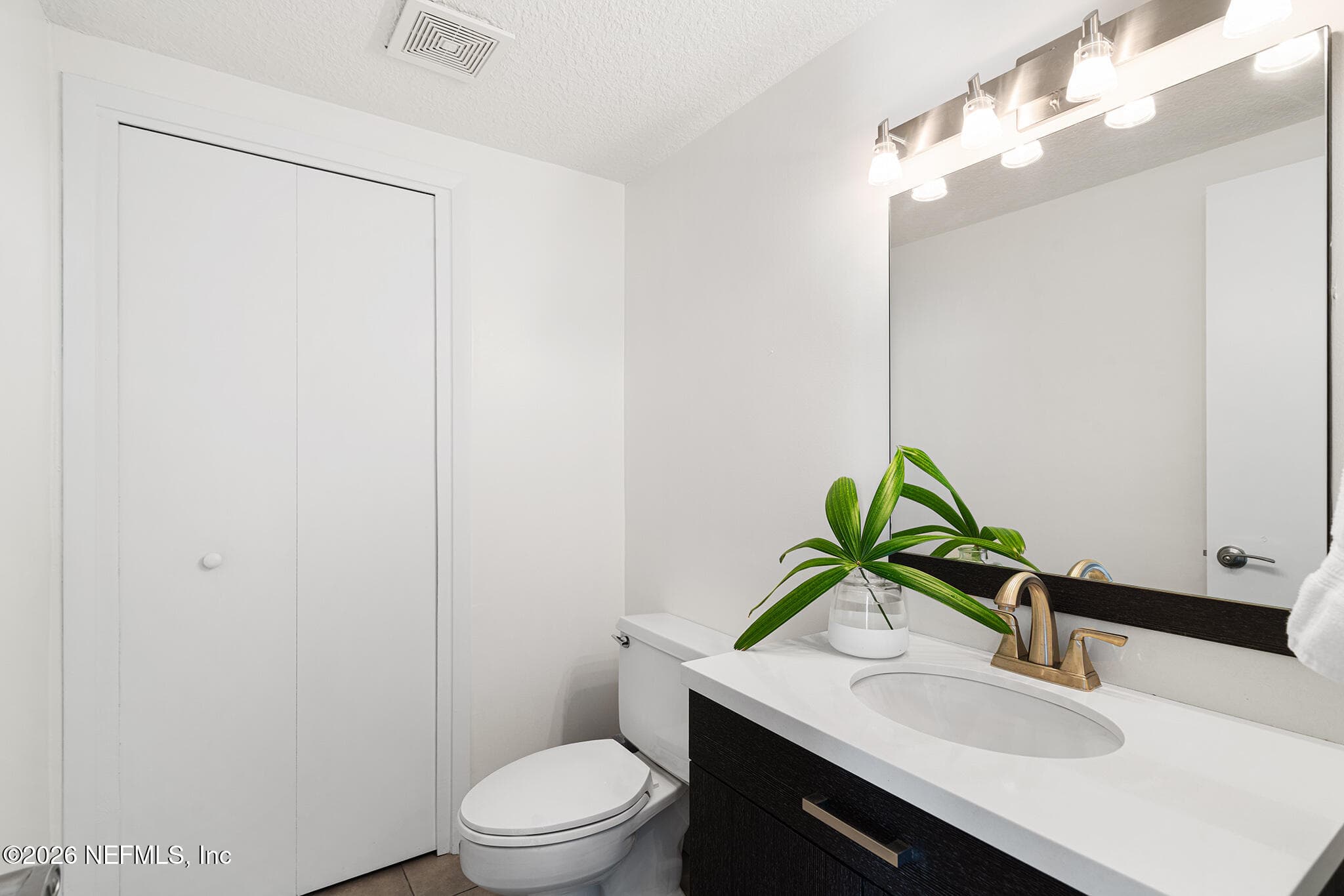 First floor guest bathroom with extra storage — 10150 LEISURE Lane N 23, Jacksonville, FL 32256