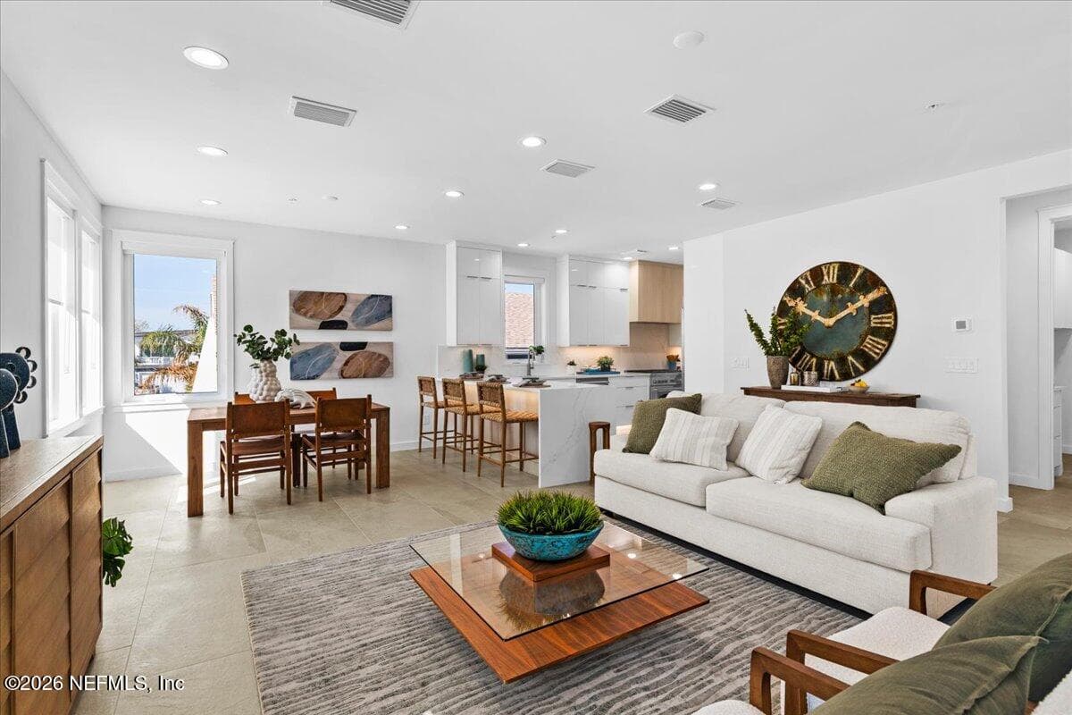 From Balcony looking into the Living Room & Dining Area — 118 13TH Avenue S 103 C, Jacksonville Beach, FL 32250