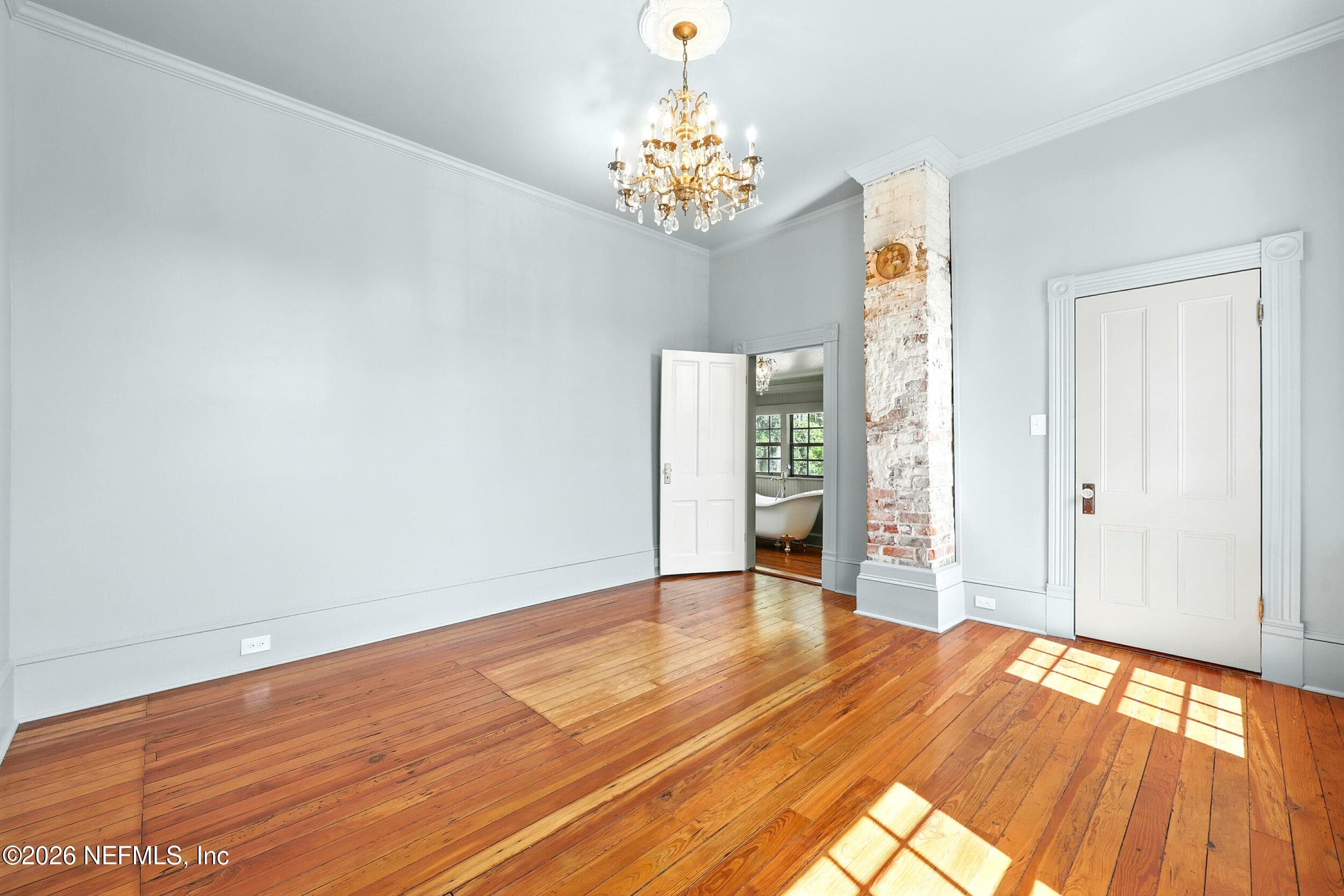 Upstairs primary bedroom in Sherwin Williams Stardew — 700 WALNUT Street, Green Cove Springs, FL 32043