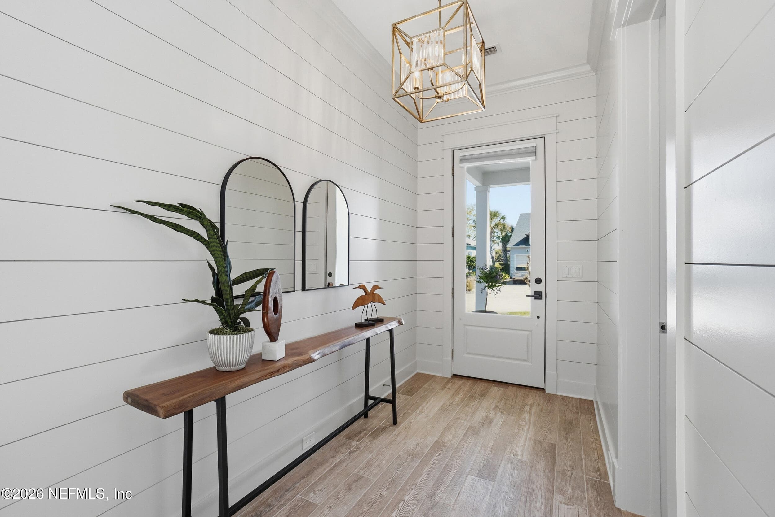 Shiplap walls and sprawling wood-like tile floor. — 1804 ATLANTIC BEACH Drive, Atlantic Beach, FL 32233