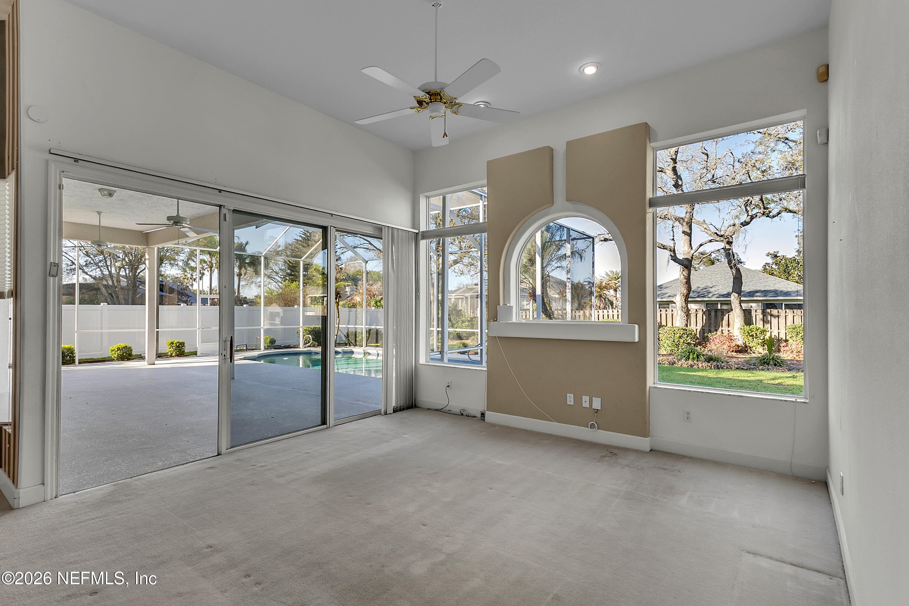 Great room open to the kitchen looking to the pool — 6030 SANCTUARY GARDEN Boulevard, Port Orange, FL 32128