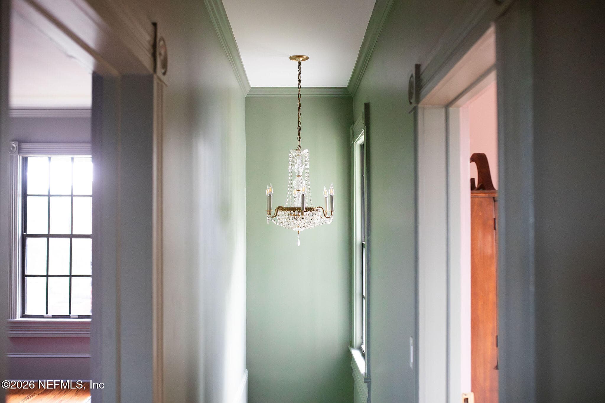 Chandelier hanging over front stairwell — 700 WALNUT Street, Green Cove Springs, FL 32043