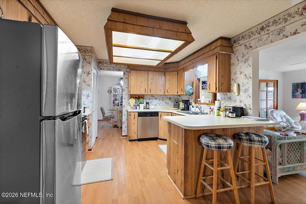 Kitchen with breakfast bar. — 21 WESTFORD Lane, Palm Coast, FL 32164