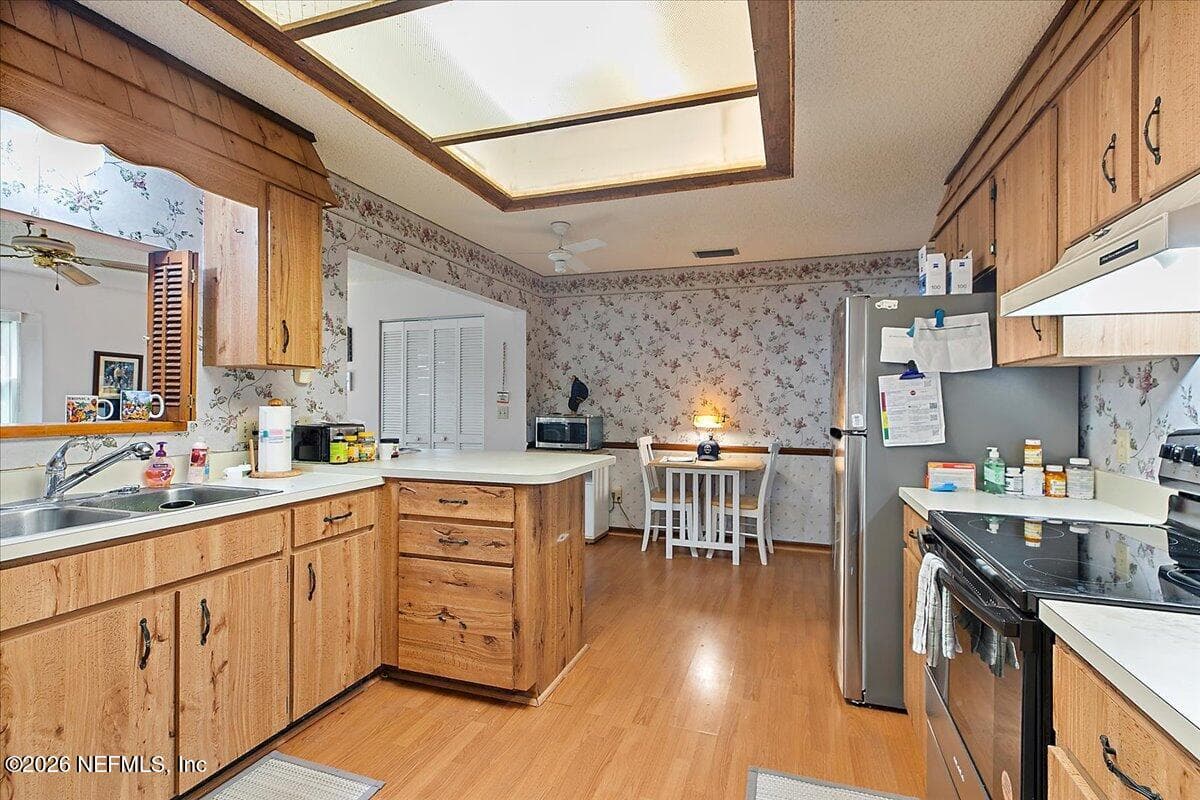 Kitchen with new appliances and nice nook for casual meals. — 21 WESTFORD Lane, Palm Coast, FL 32164