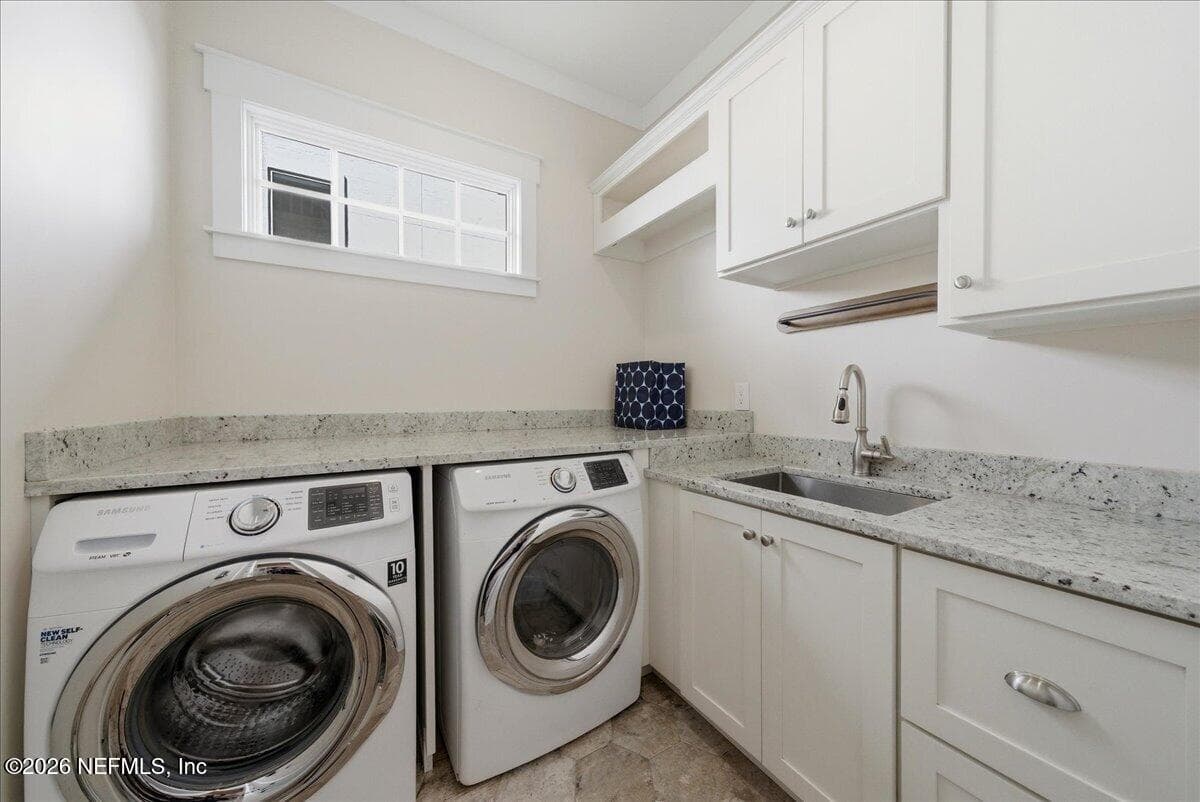 Inside Laundry with sink, cabinetry, folding counter & a window for extra light — 109 LAUREL Way, Ponte Vedra Beach, FL 32082