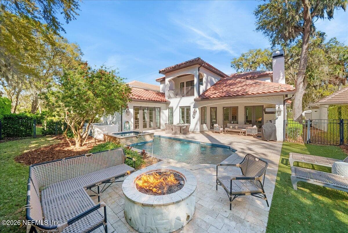 Vacation—Stay in for the summer. With a pristine pool, spa, and firepit, this backyard is the destination your friends will never want to leave. — 109 LAUREL Way, Ponte Vedra Beach, FL 32082