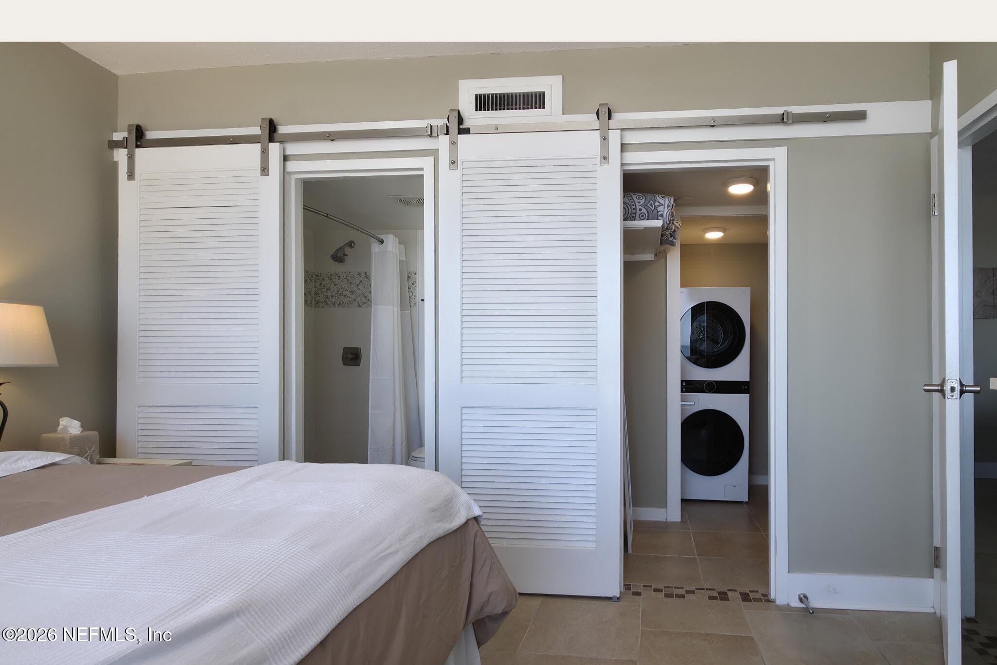 Primary Bedroom & Laundry — 601 1ST Street S 3C, Jacksonville Beach, FL 32250