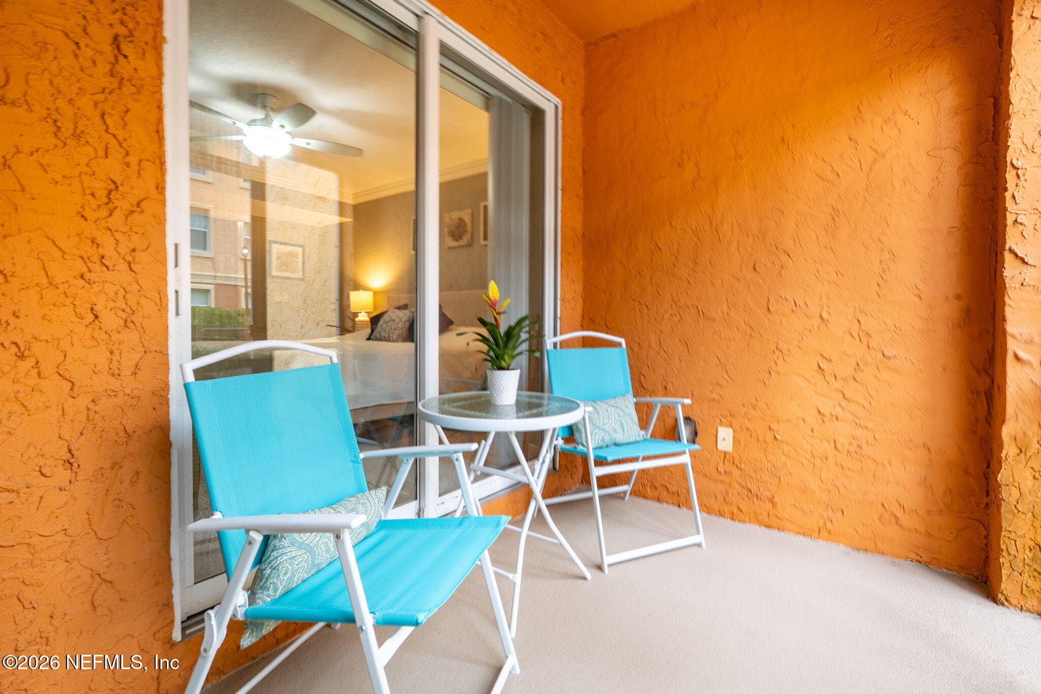 Screened porch accessible via the main living area and primary suite. Perfect for morning coffee or evening wind-down. — 105 25TH Avenue S L11, Jacksonville Beach, FL 32250
