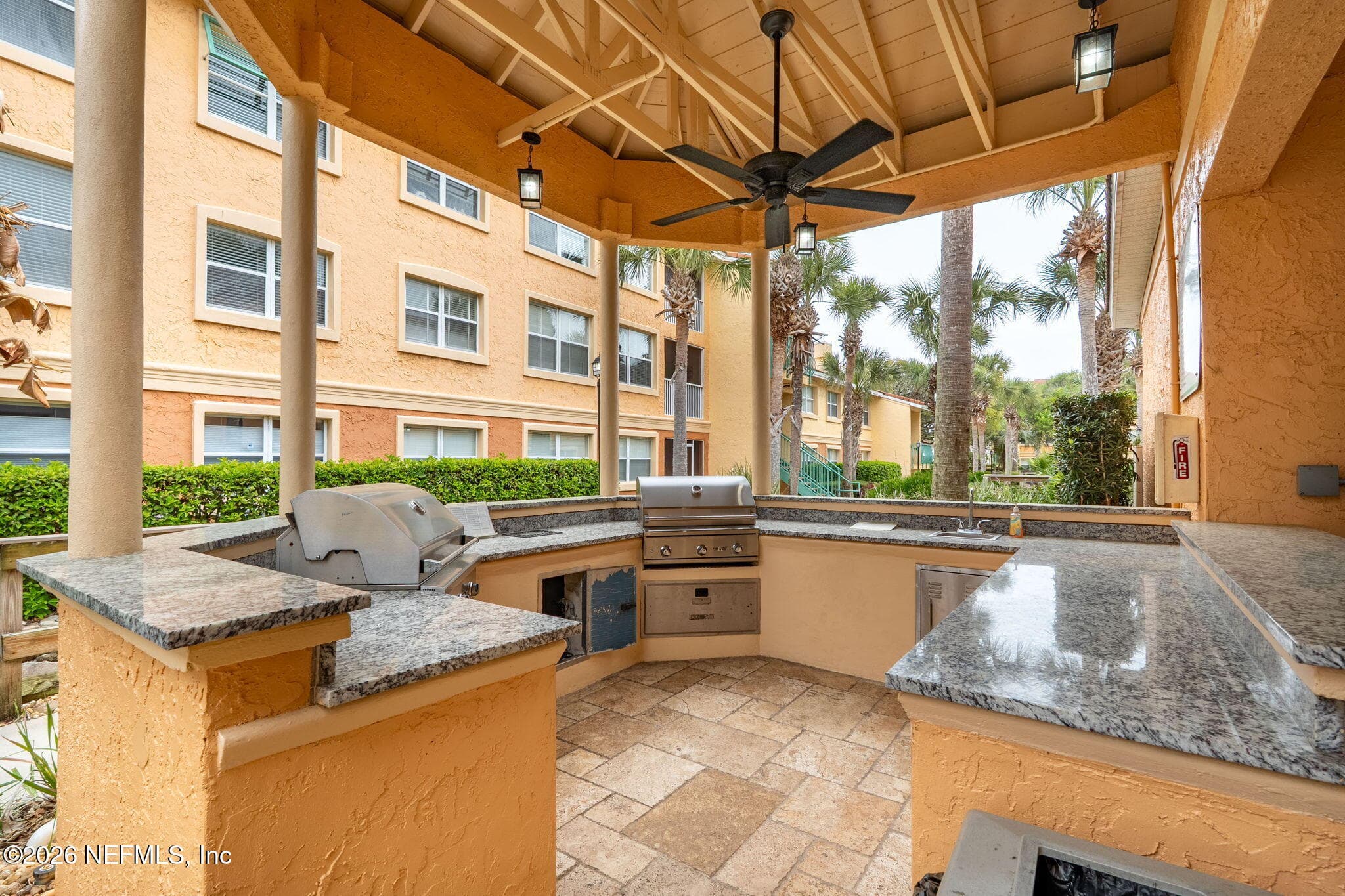 Outdoor kitchen right next to condo are a welcome amenity — 105 25TH Avenue S L11, Jacksonville Beach, FL 32250