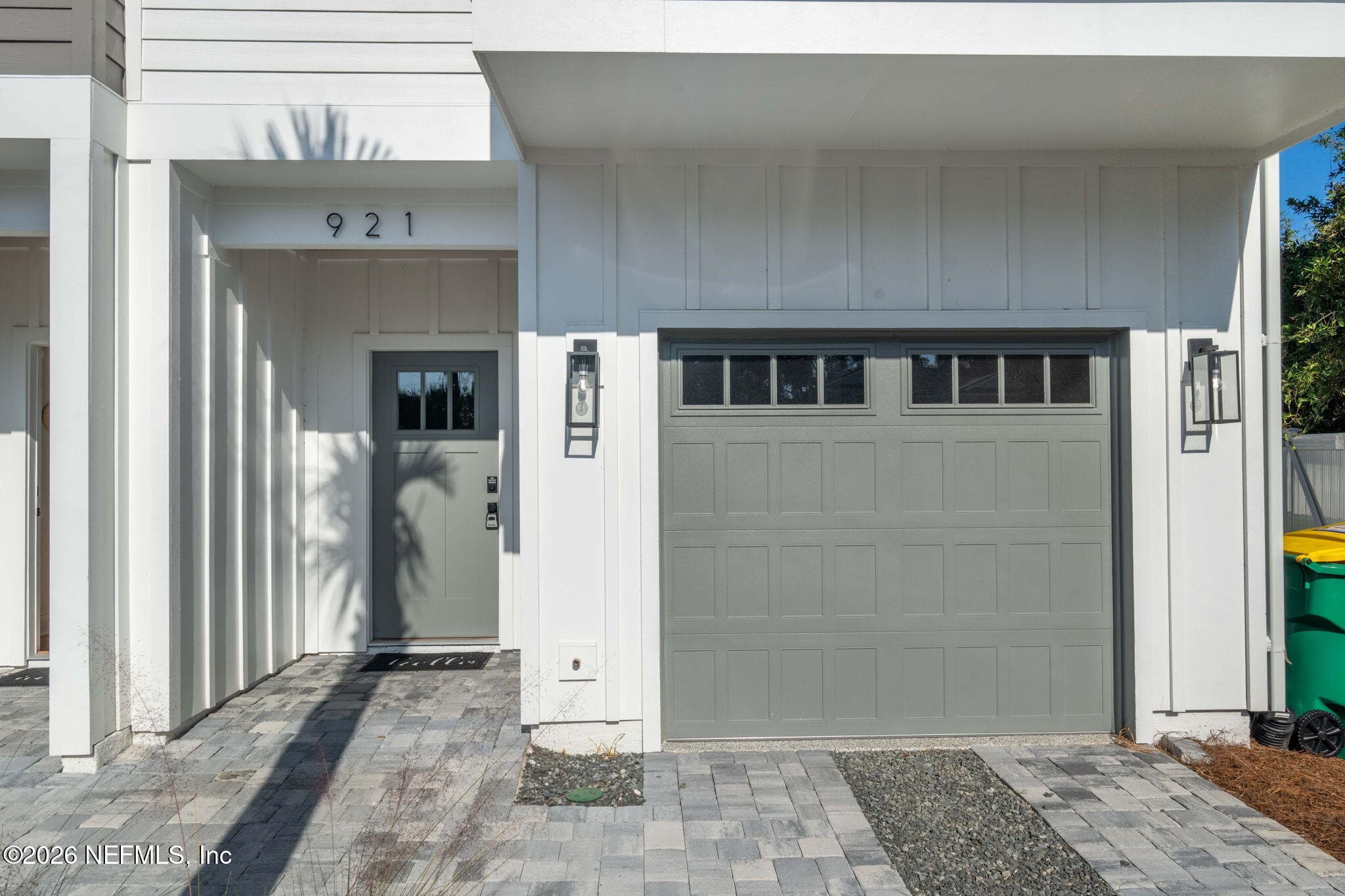 Wifi compatible garage doors and custom stained tongue and groove ceilings at front entry, primary bedroom and 2nd porch ceilings — 921 2ND Avenue S, Jacksonville Beach, FL 32250