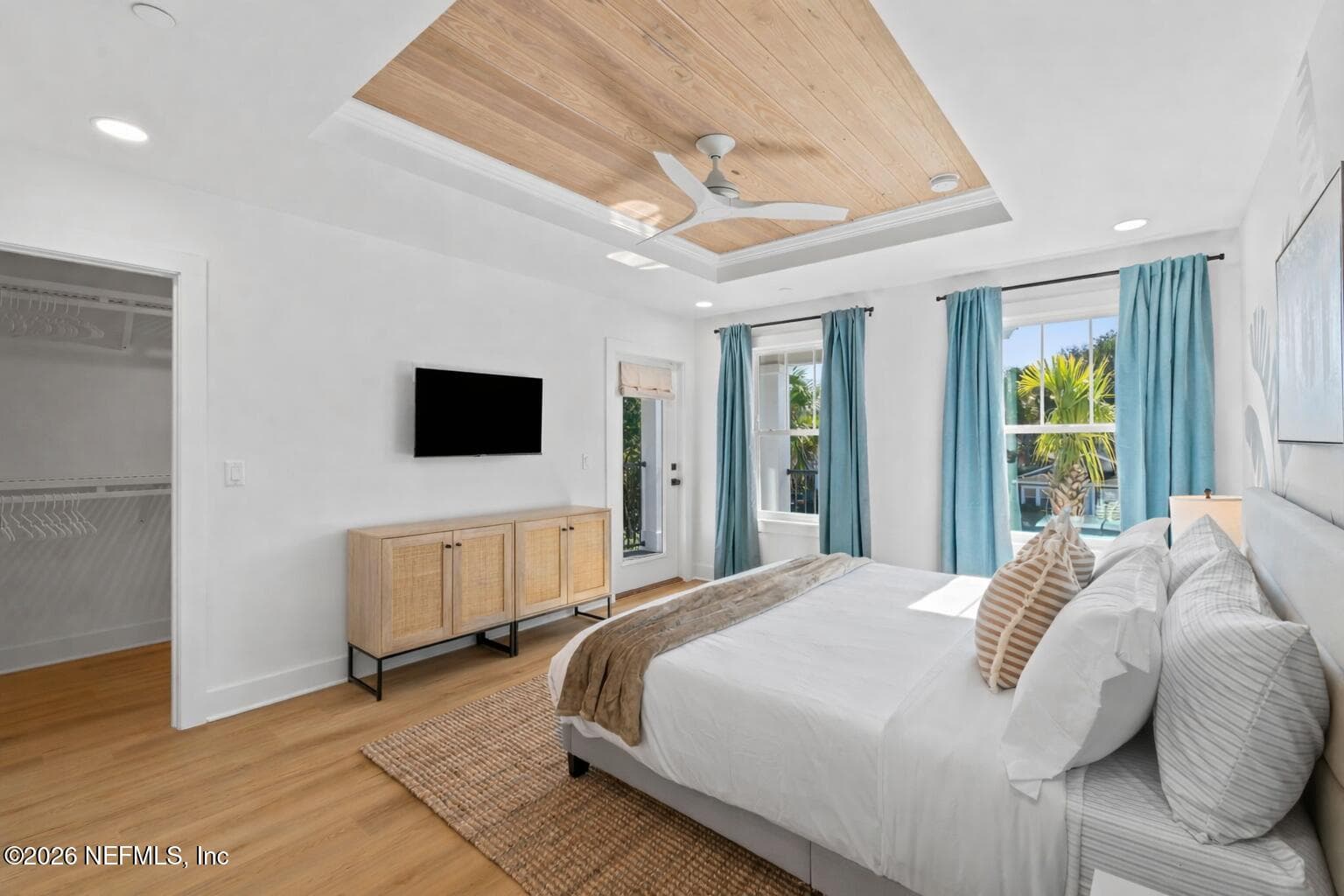 Primary bedroom with tongue and groove ceiling and ventilated wood shelving systems in ALL closets — 921 2ND Avenue S, Jacksonville Beach, FL 32250