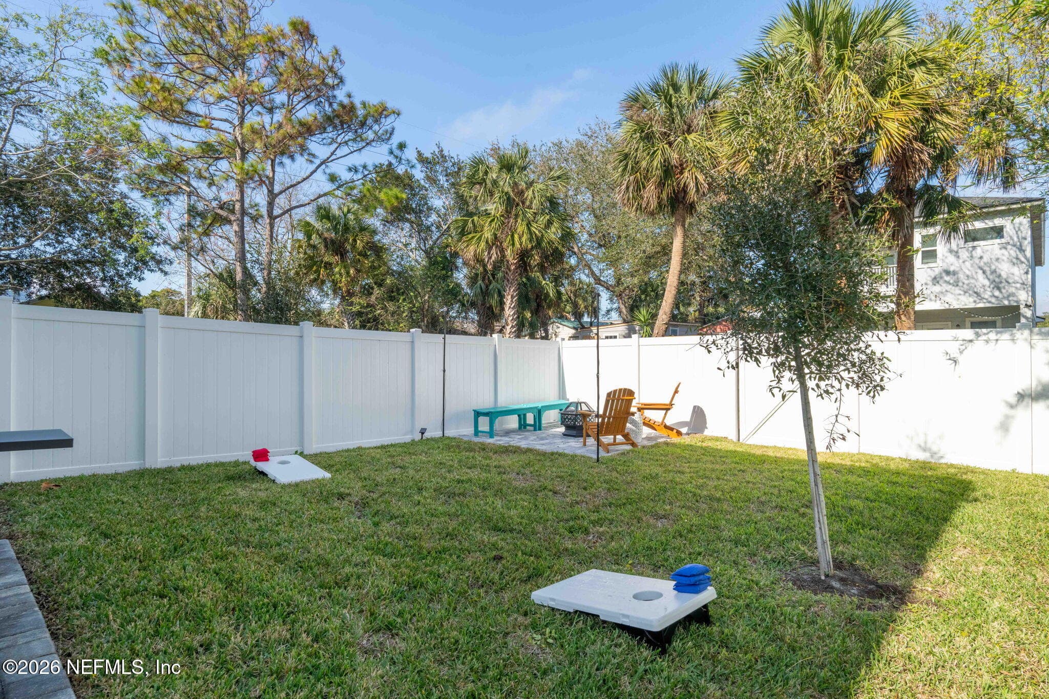 Fully fenced backyard with fire-pit area — 921 2ND Avenue S, Jacksonville Beach, FL 32250