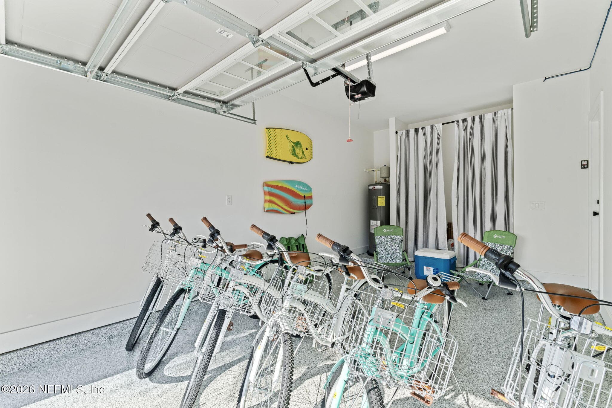 Garage features hybrid epoxy basecoat full flake broadcast
(gravel) & polyaspartic topcoat — 923 2ND Avenue S, Jacksonville Beach, FL 32250