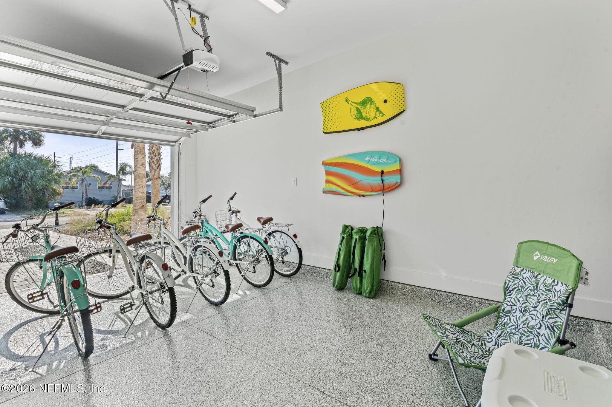 Garage features hybrid epoxy basecoat full flake broadcast
(gravel) & polyaspartic topcoat — 923 2ND Avenue S, Jacksonville Beach, FL 32250