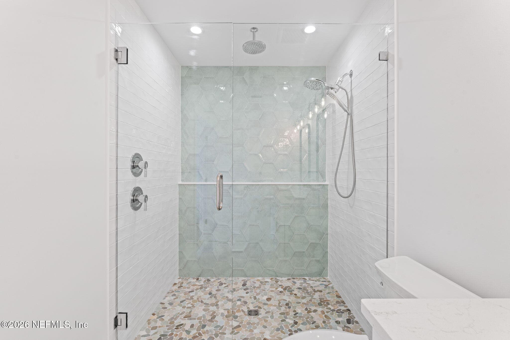Verso Combination shower featuring Infiniti dial offers both a rainshower and hand shower in one sleek design, plus additional railhead from ceiling overhead — 923 2ND Avenue S, Jacksonville Beach, FL 32250