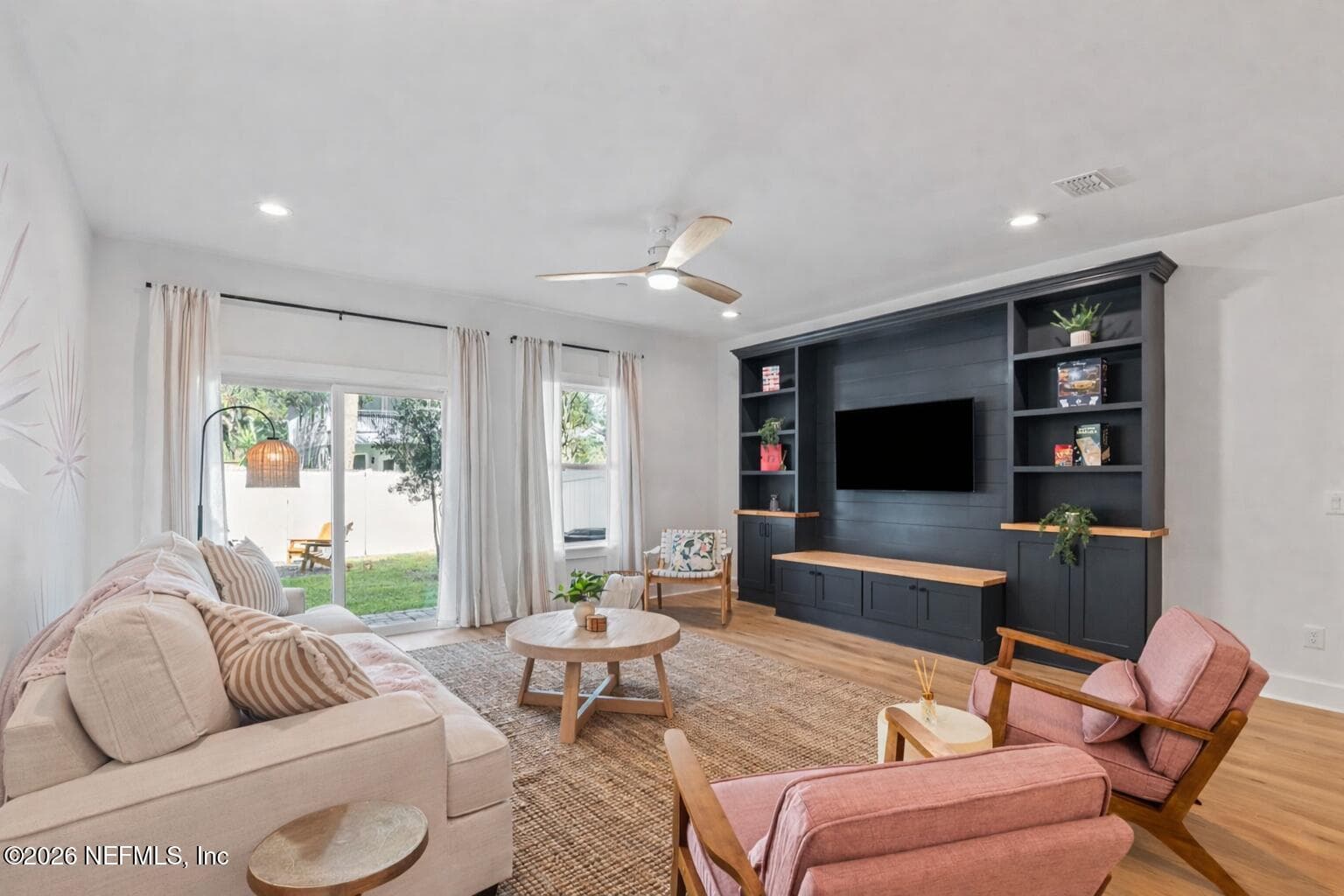 Modern finishes and custom built-in entertainment unit — 923 2ND Avenue S, Jacksonville Beach, FL 32250