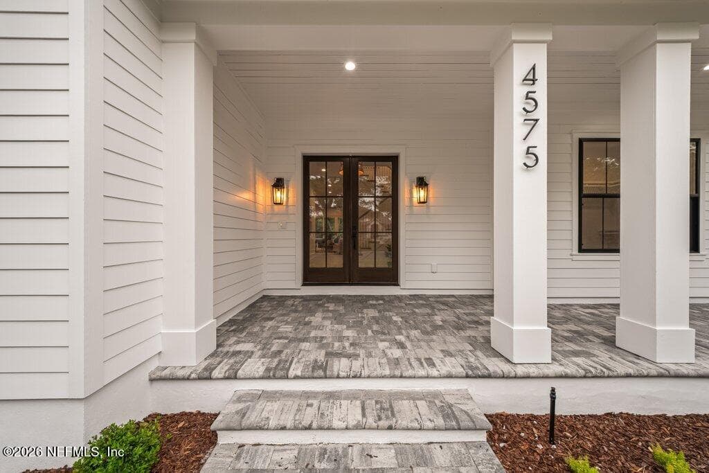 Large covered porch to greet family and friends. — 4575 SWILCAN BRIDGE Lane N, Jacksonville, FL 32224