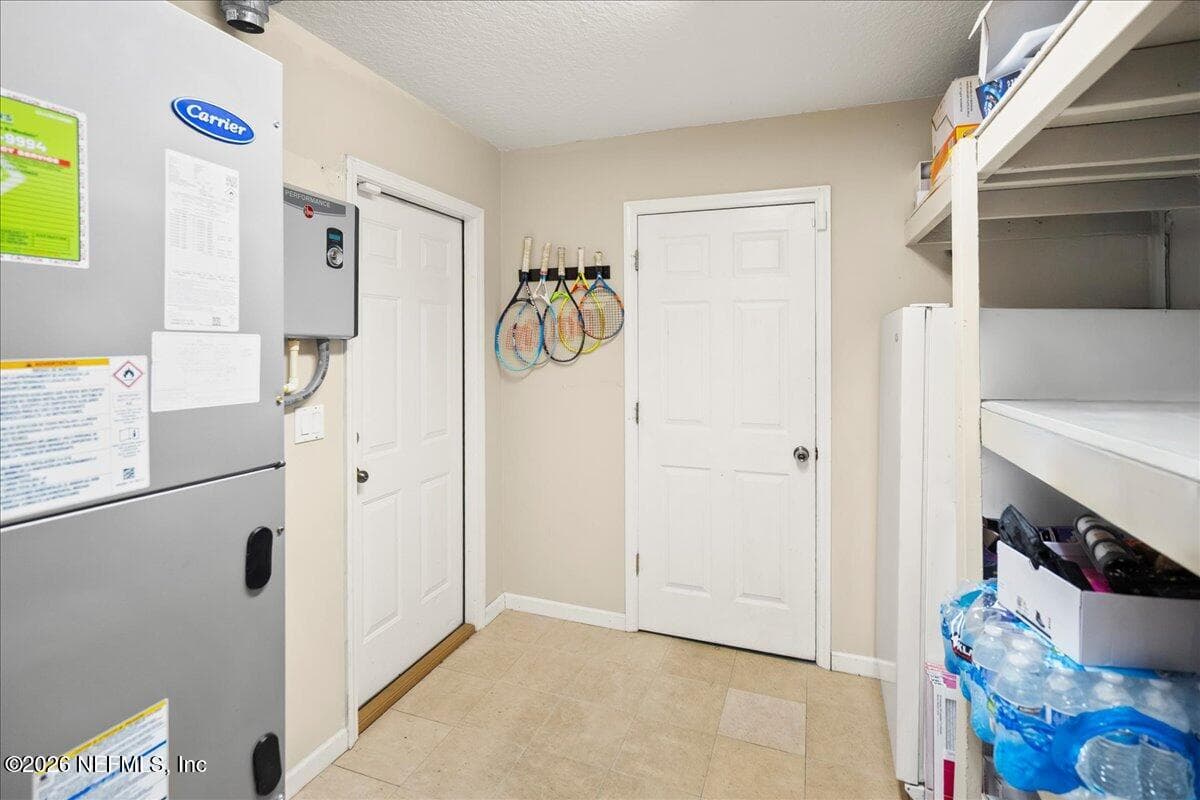 Located between Garage and Laundry Room — 2470 COUNTRY SIDE Drive, Fleming Island, FL 32003