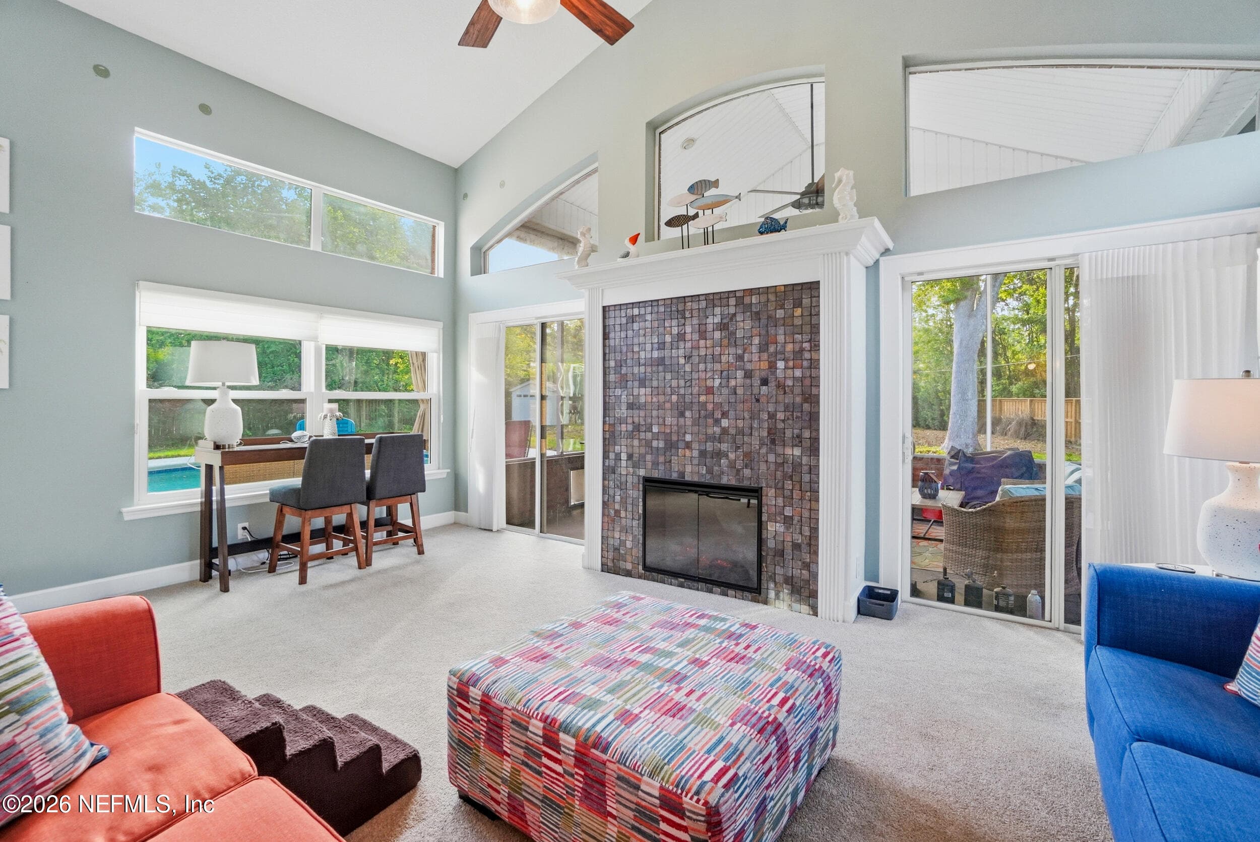 Electric Fireplace in sunroom — 2408 STOCKTON Drive, Fleming Island, FL 32003