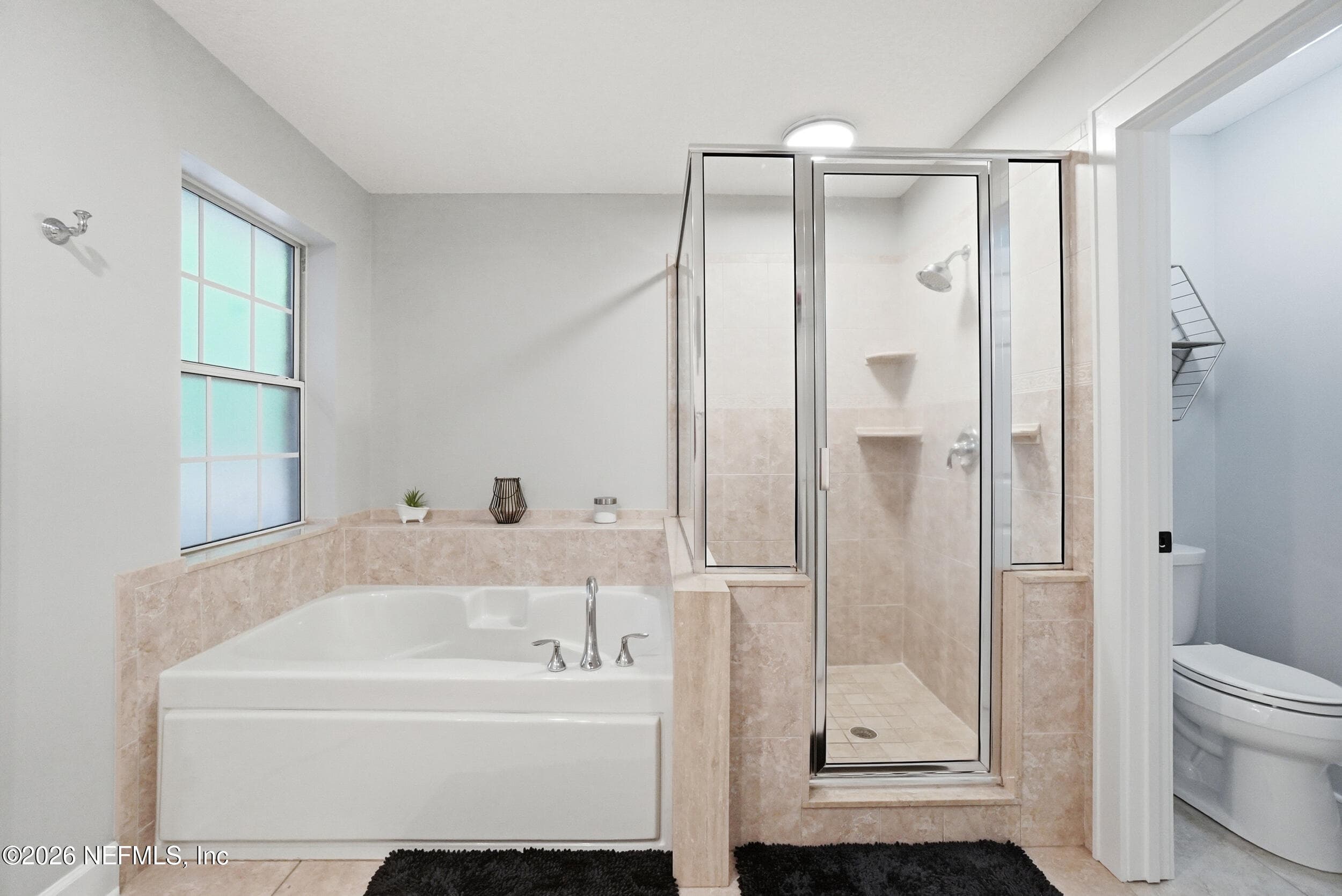 Large Master bathroom with shower and separate garden tub — 2408 STOCKTON Drive, Fleming Island, FL 32003